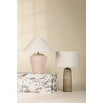 Inspired by raw beauty of the desert, this whitewashed terracotta table lamp is calm and refreshing. The textural body contrasts beautifully with the angular tapered white linen shade. An Aged Brass frame provides a surprising metallic finish. Part of THELIFESTYLEDCO® collection. Amethyst Home provides interior design, new home construction design consulting, vintage area rugs, and lighting in the Monterey metro area.