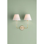 The refined framework and soft, tailored shades of Wedgewood evoke a sense of timeless, European charm. Available with one or two lights, this sconce features a classic shape, mixed finishes, and gently curved metalwork. Amethyst Home provides interior design, new home construction design consulting, vintage area rugs, and lighting in the Dallas metro area.