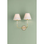 The refined framework and soft, tailored shades of Wedgewood evoke a sense of timeless, European charm. Available with one or two lights, this sconce features a classic shape, mixed finishes, and gently curved metalwork. Amethyst Home provides interior design, new home construction design consulting, vintage area rugs, and lighting in the Houston metro area.