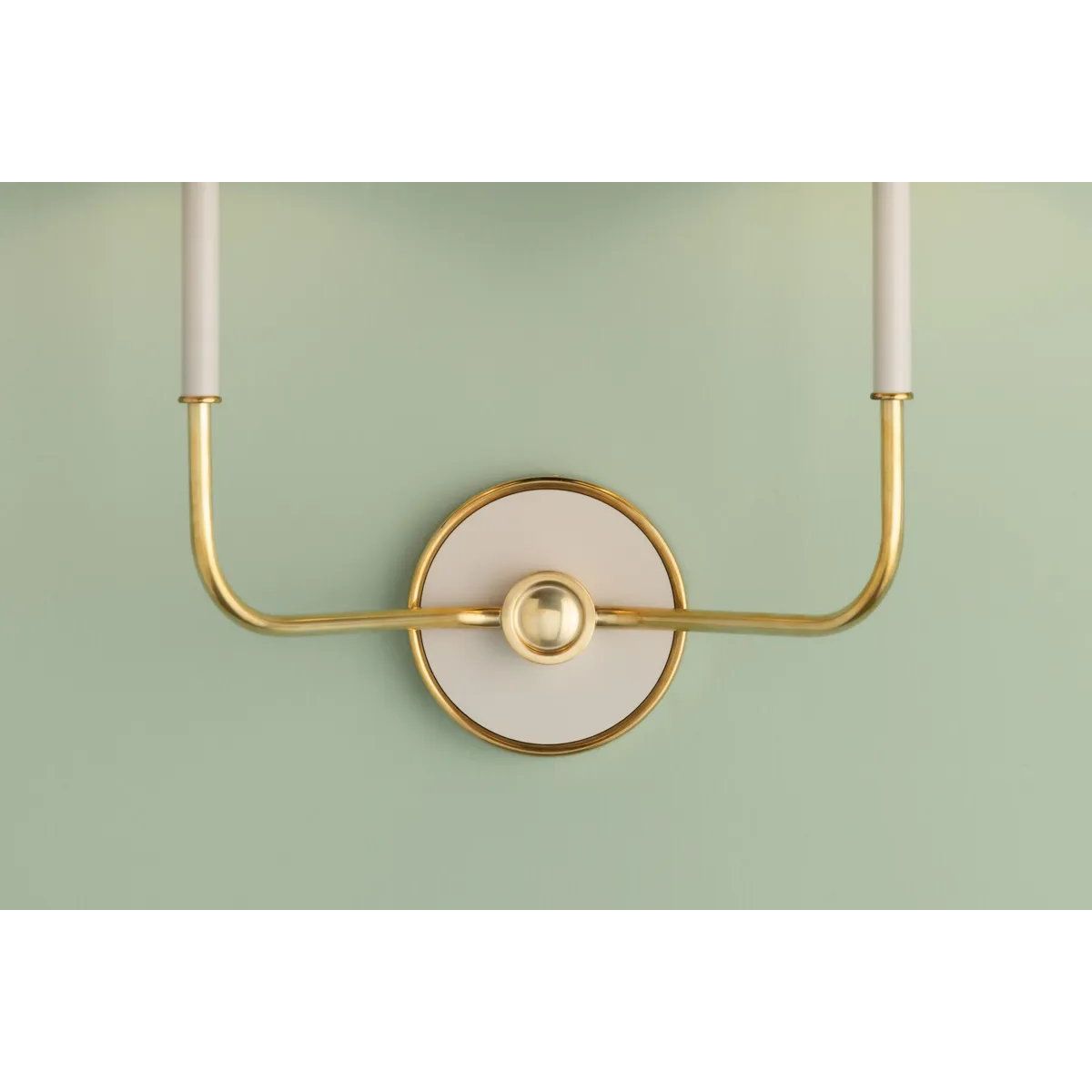 The refined framework and soft, tailored shades of Wedgewood evoke a sense of timeless, European charm. Available with one or two lights, this sconce features a classic shape, mixed finishes, and gently curved metalwork. Amethyst Home provides interior design, new home construction design consulting, vintage area rugs, and lighting in the Tampa metro area.