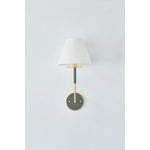 The refined framework and soft, tailored shades of Wedgewood evoke a sense of timeless, European charm. Available with one or two lights, this sconce features a classic shape, mixed finishes, and gently curved metalwork. Amethyst Home provides interior design, new home construction design consulting, vintage area rugs, and lighting in the Boston metro area.