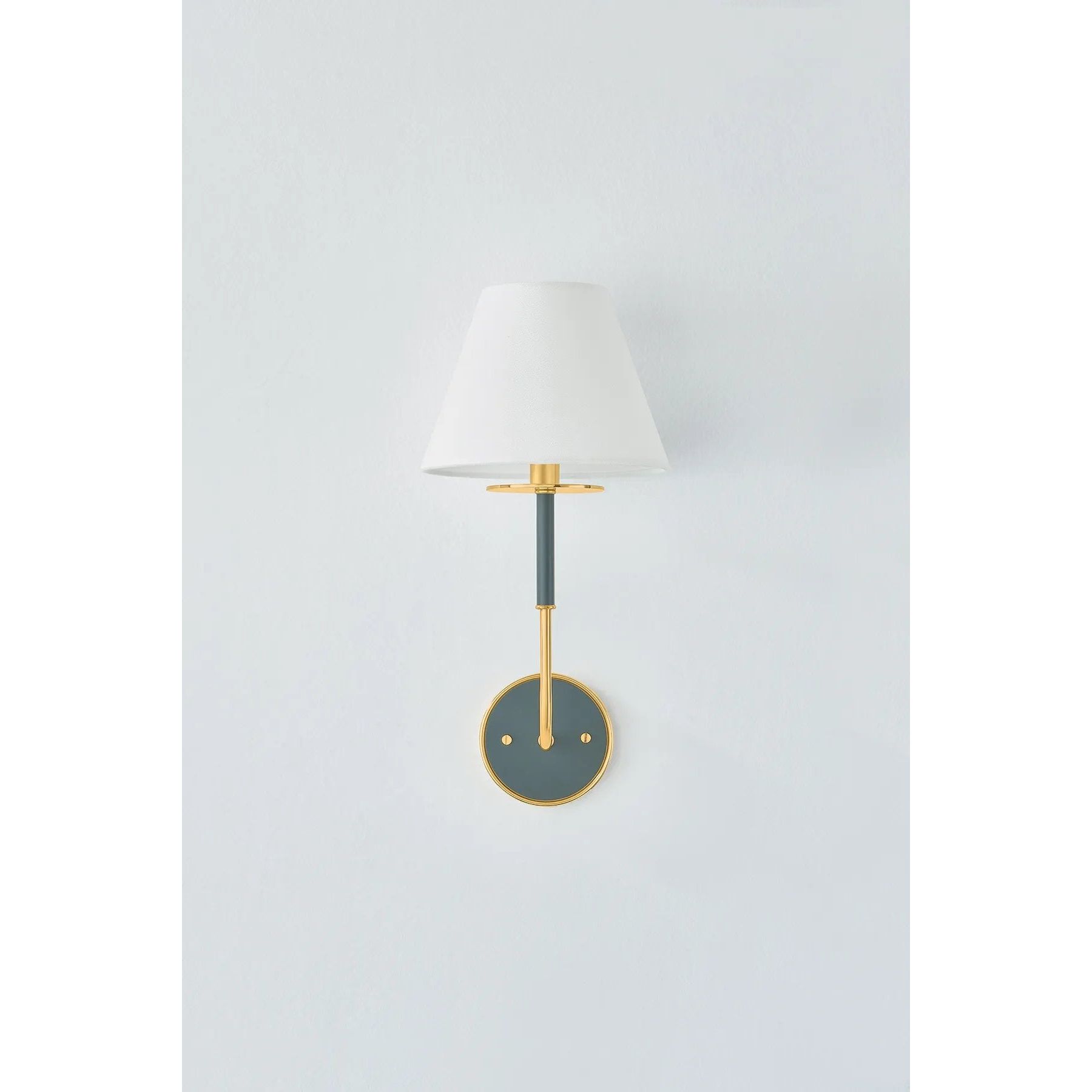 The refined framework and soft, tailored shades of Wedgewood evoke a sense of timeless, European charm. Available with one or two lights, this sconce features a classic shape, mixed finishes, and gently curved metalwork. Amethyst Home provides interior design, new home construction design consulting, vintage area rugs, and lighting in the Boston metro area.