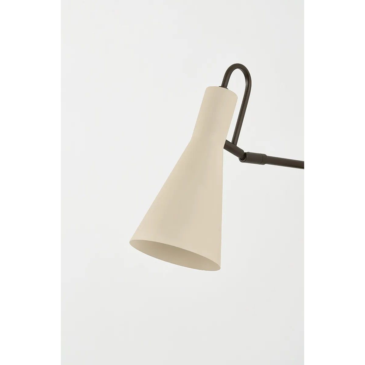 The Yvette plug-in sconce uses a modern lens to reimagine vintage design motifs. The geometry of the metalwork has been simplified to basic lines and curves, with the arc-shaped piece above the shade serving as a handle for adjustments. Finished in creamy Soft Bisque, this design-forward sconce adds plenty of directional light to a desk or bedside. Amethyst Home provides interior design, new home construction design consulting, vintage area rugs, and lighting in the Newport Beach metro area.