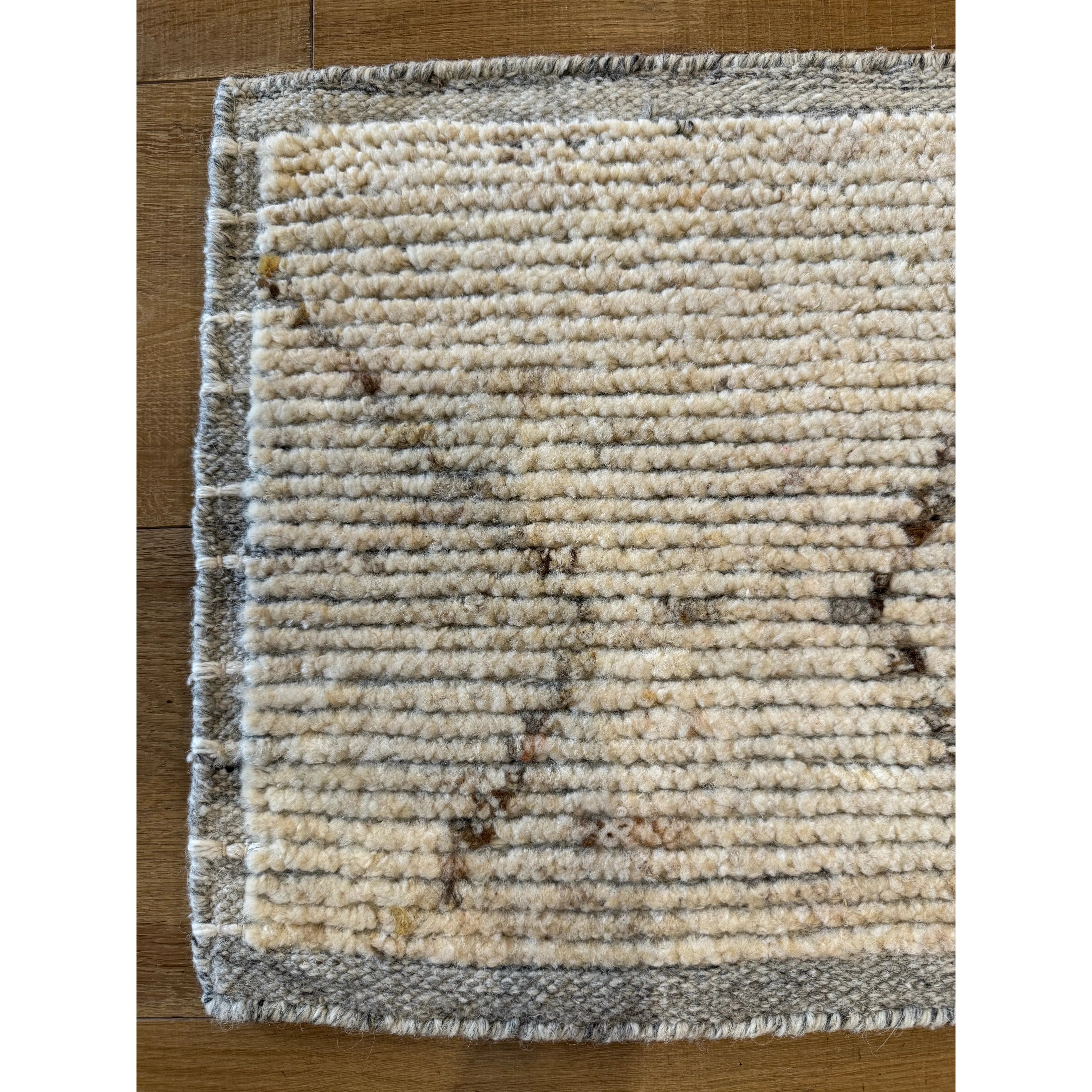 Subtle linear textures and natural colorways define the irresistible quality of the Seora collection. The Tepal area rug features a distressed trellis motif for an intriguing dose of modern appeal. The textural, wool pile contains no dye, reflecting the natural colors of the sheep, for a rich and grounding palette of cream, brown, gray, and flecks of black. Amethyst Home provides interior design, new construction, custom furniture, and area rugs in the Kansas City metro area.