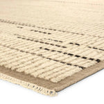 Full of texture, the handknotted Kazben Andar stuns with modern Moroccan patterns in natural hues. The Andar design delights with a taupe, tan, and brown linear pattern. A thin border adds the finishing touches to this elevated accent piece. Low, ribbed pile creates visual intrigue and grounds any contemporary space. Amethyst Home provides interior design, new home construction design consulting, vintage area rugs, and lighting in the Los Angeles metro area.