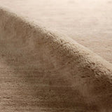 Featuring Colson Hand-Knotted Rug by Jaipur Living at Amethyst Home. The Bekarys Colson features a shaggy texture with a remarkably soft pile that invites relaxation and warmth. Its solid neutral tones provide a versatile backdrop that enhances any decor. This plush, hand-knotted gem offers both tactile pleasure and visual appeal.Hand Knotted100% WoolBKR01. Amethyst Home provides interior design, new home construction design consulting, vintage area rugs, and lighting in the Alpharetta metro area.