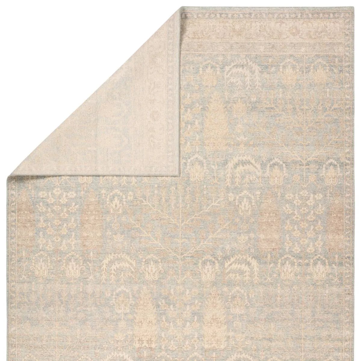 The Onessa Delwyn marries traditional motifs with soft, subdued colorways for the perfect blend of fresh and time-honored style. These hand-knotted wool rugs feature hand-sheared quality with a coveted vintage look. The Delwyn rug features distressed Tree of Life patterns granting added balance and harmony to the centerpiece of a room. Amethyst Home provides interior design, new home construction design consulting, vintage area rugs, and lighting in the Charlotte metro area.