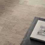 Featuring Tenley Rug by Jaipur Living at Amethyst Home. The hand-tufted Labyrinth Tenley presents abstract designs crafted from plush wool with a cut and looped pile, creating a rich, tactile texture. The Tenley design showcases a bold, geometric pattern with a modern brutalist influence in shades of gray and taupe, effortlessly adding depth and sophisticat. Amethyst Home provides interior design, new home construction design consulting, vintage area rugs, and lighting in the Calabasas metro area.