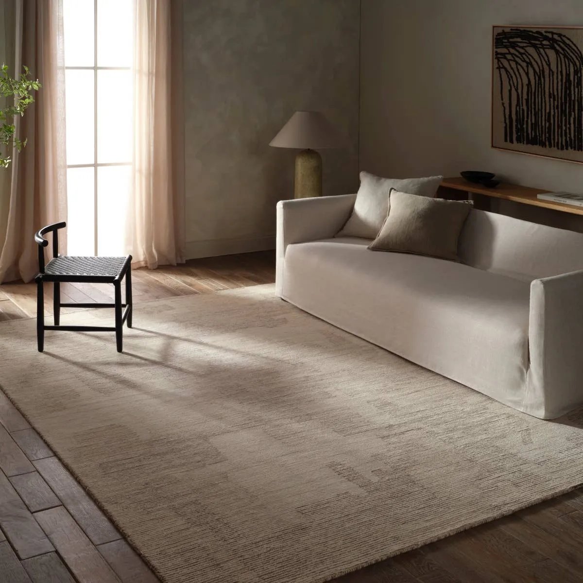 Featuring Tenley Rug by Jaipur Living at Amethyst Home. The hand-tufted Labyrinth Tenley presents abstract designs crafted from plush wool with a cut and looped pile, creating a rich, tactile texture. The Tenley design showcases a bold, geometric pattern with a modern brutalist influence in shades of gray and taupe, effortlessly adding depth and sophisticati. Amethyst Home provides interior design, new home construction design consulting, vintage area rugs, and lighting in the Monterey metro area.