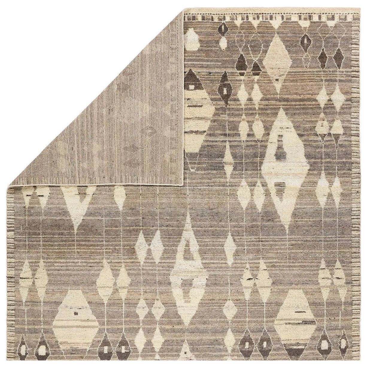 Featuring Zaira Tonnara Hand-Knotted Rug by Jaipur Living at Amethyst Home. Enrich living spaces with the exotic allure of the Zaira Collection - a fusion of modern Moroccan designs and unparalleled craftsmanship. Handknotted in India with 22 knots per square inch, these rugs exude luxury and artistry. The Tonnara rug showcases an intriguing diamond patter. Amethyst Home provides interior design, new home construction design consulting, vintage area rugs, and lighting in the Washington metro area.