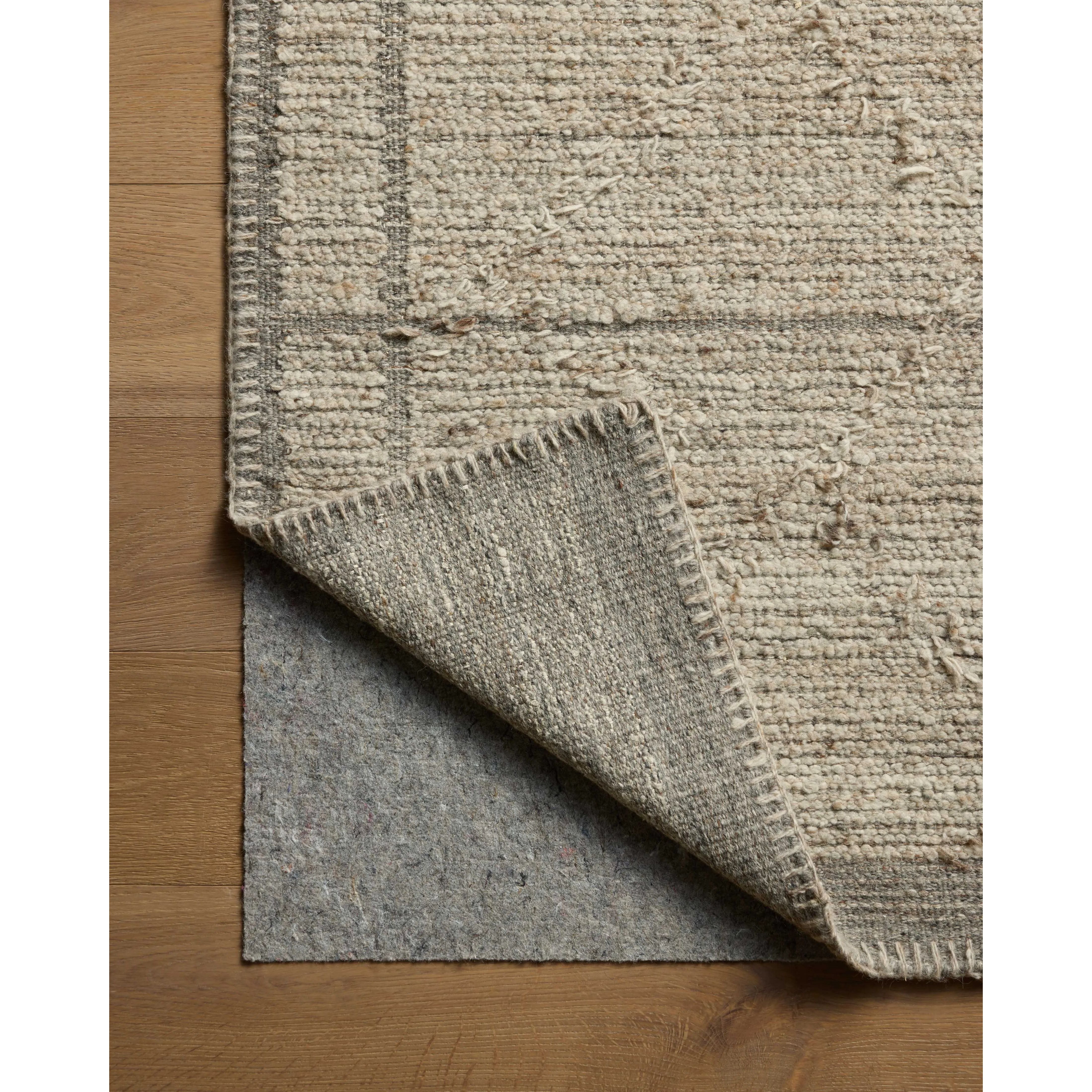 Beautifully crafted by hand, the Bowie Collection by Amber Lewis x Loloi is a textured area rug with an earthy, organic aesthetic. The pile has a flatweave base with chunkier, slightly raised geometric motifs and whipstitched edges. It’s an elegant yet easy-to-work-with rug for living rooms, bedrooms, and other high-traffic areas of the home. Amethyst Home provides interior design, new home construction design consulting, vintage area rugs, and lighting in the San Diego metro area.