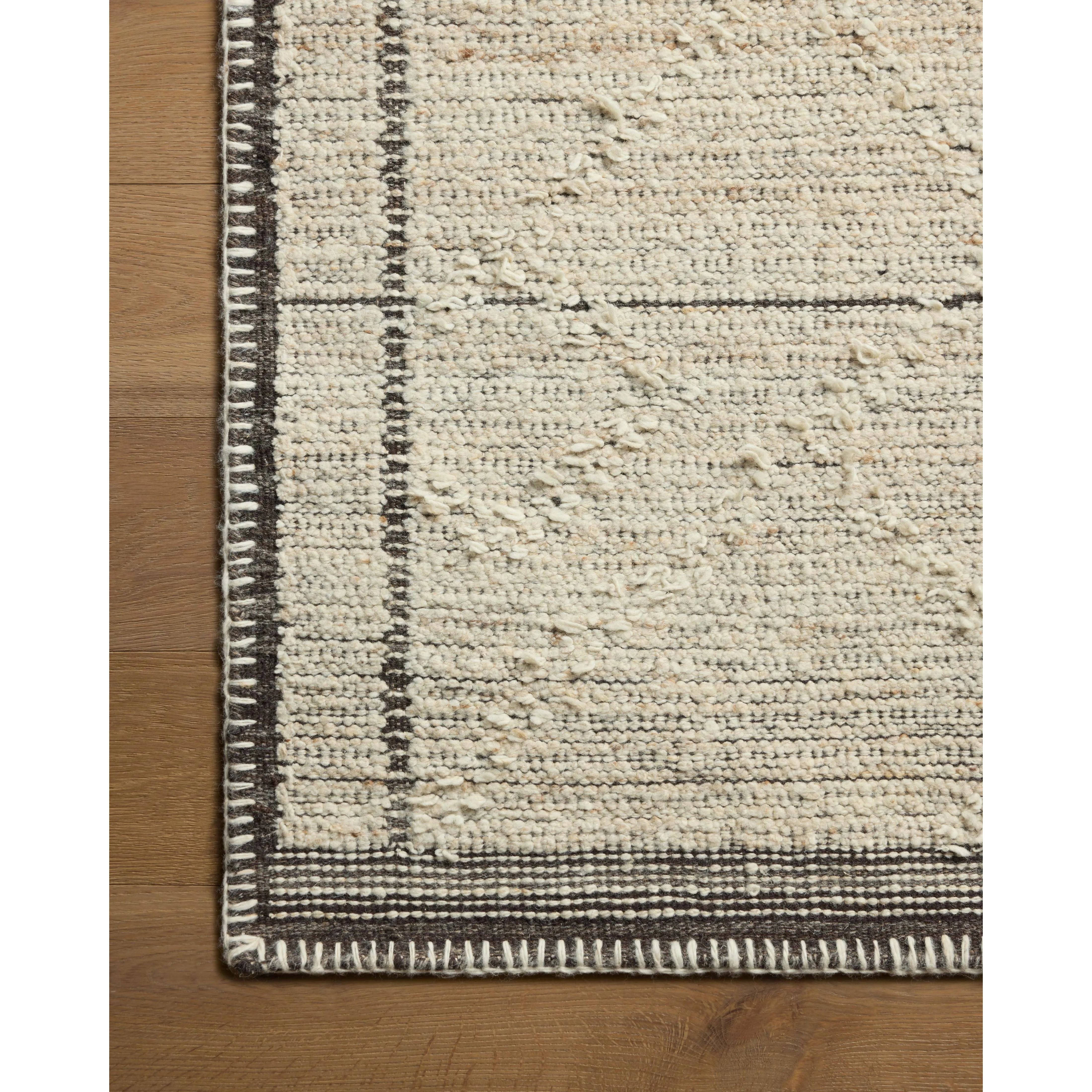 Beautifully crafted by hand, the Bowie Collection by Amber Lewis x Loloi is a textured area rug with an earthy, organic aesthetic. The pile has a flatweave base with chunkier, slightly raised geometric motifs and whipstitched edges. It’s an elegant yet easy-to-work-with rug for living rooms, bedrooms, and other high-traffic areas of the home. Amethyst Home provides interior design, new home construction design consulting, vintage area rugs, and lighting in the Omaha metro area.