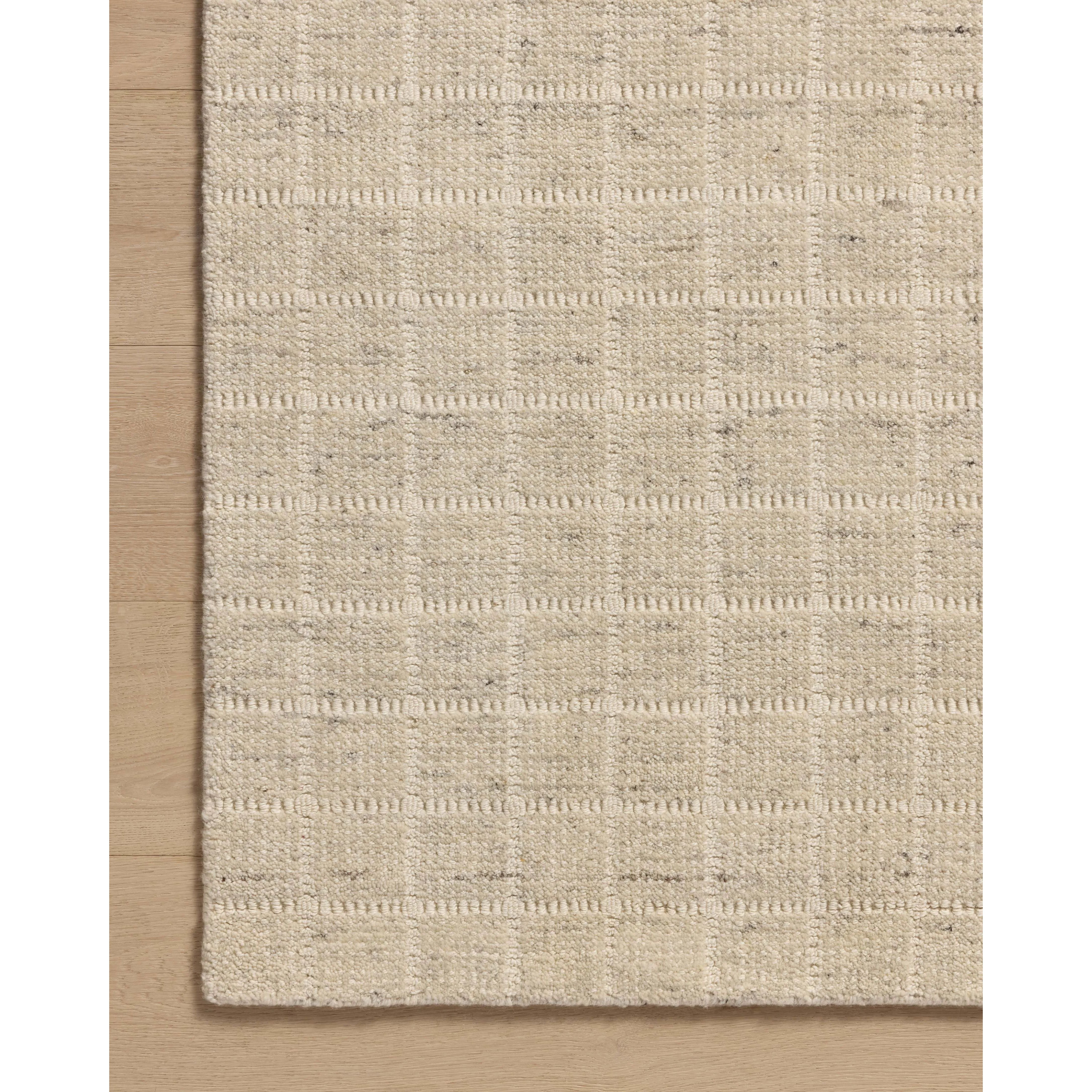 Featuring Amber Lewis x Loloi Cedar Antique Ivory Rug by Loloi at Amethyst Home. The Cedar Collection by Amber Lewis x Loloi is a hand-loomed area rug with a clean gridded design in contrasting ivory. The rugs blended wool and cotton pile is substantial and soft, with flecked tones that add depth to the neutral palette. This collection is hand-loomed of woo. Amethyst Home provides interior design, new home construction design consulting, vintage area rugs, and lighting in the Park City metro area.