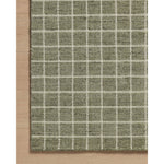 Featuring Amber Lewis x Loloi Cedar Olive / Ivory Rug by Loloi at Amethyst Home. The Cedar Collection by Amber Lewis x Loloi is a hand-loomed area rug with a clean gridded design in contrasting ivory. The rugs blended wool and cotton pile is substantial and soft, with flecked tones that add depth to the neutral palette. This collection is hand-loomed of woo. Amethyst Home provides interior design, new home construction design consulting, vintage area rugs, and lighting in the Charlotte metro area.