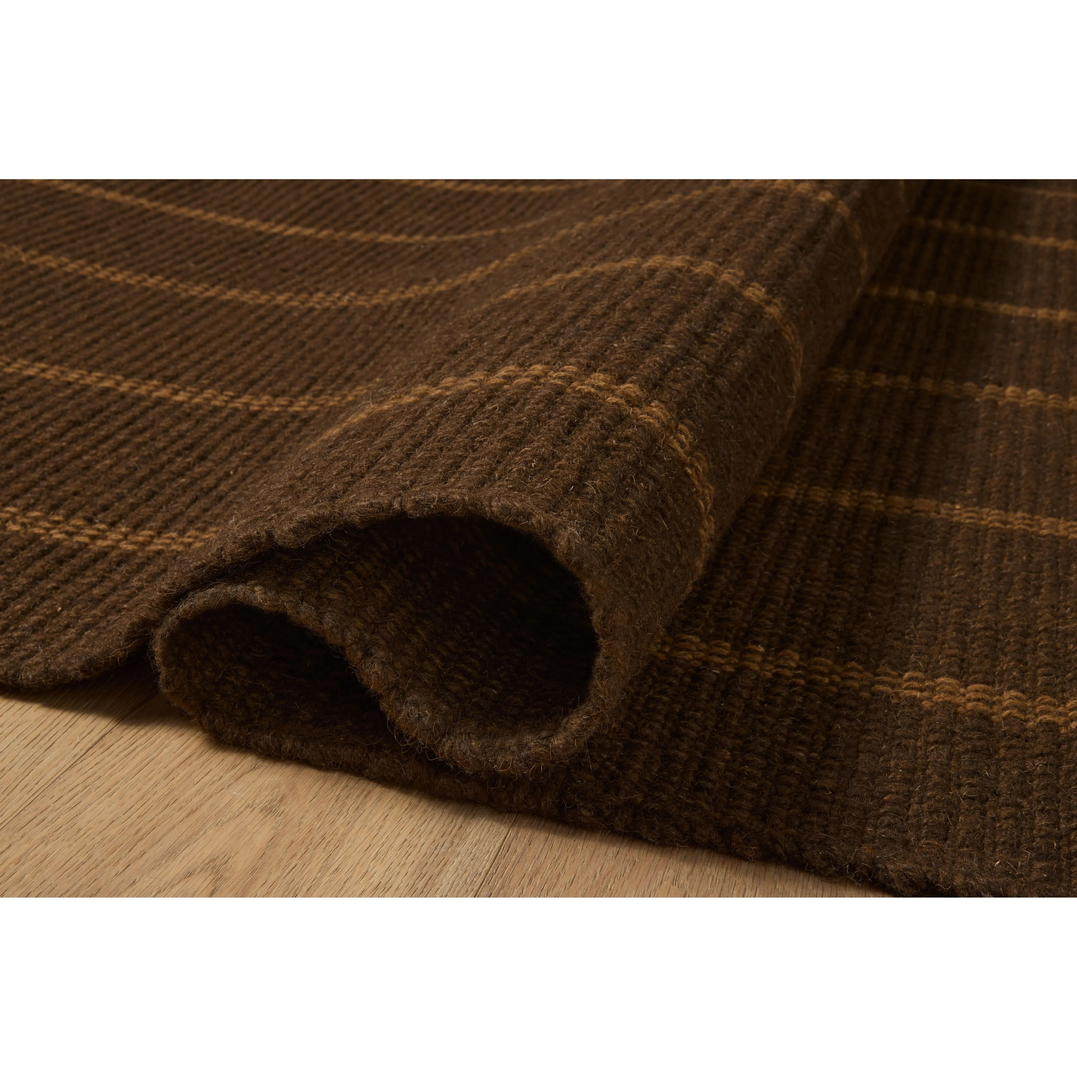 The Harlan Collection by Amber Lewis x Loloi is a classic striped flatweave area rug in the interior designer’s signature warm, earthy tones. The rug has a chunky wool pile with whipstitch borders that add character and natural texture to living rooms, bedrooms, and other well-loved areas of the home. Amethyst Home provides interior design, new home construction design consulting, vintage area rugs, and lighting in the Dallas metro area.