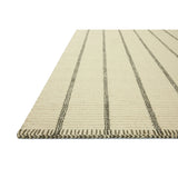 The Harlan Collection by Amber Lewis x Loloi is a classic striped flatweave area rug in the interior designer’s signature warm, earthy tones. The rug has a chunky wool pile with whipstitch borders that add character and natural texture to living rooms, bedrooms, and other well-loved areas of the home. Amethyst Home provides interior design, new home construction design consulting, vintage area rugs, and lighting in the Scottsdale metro area.