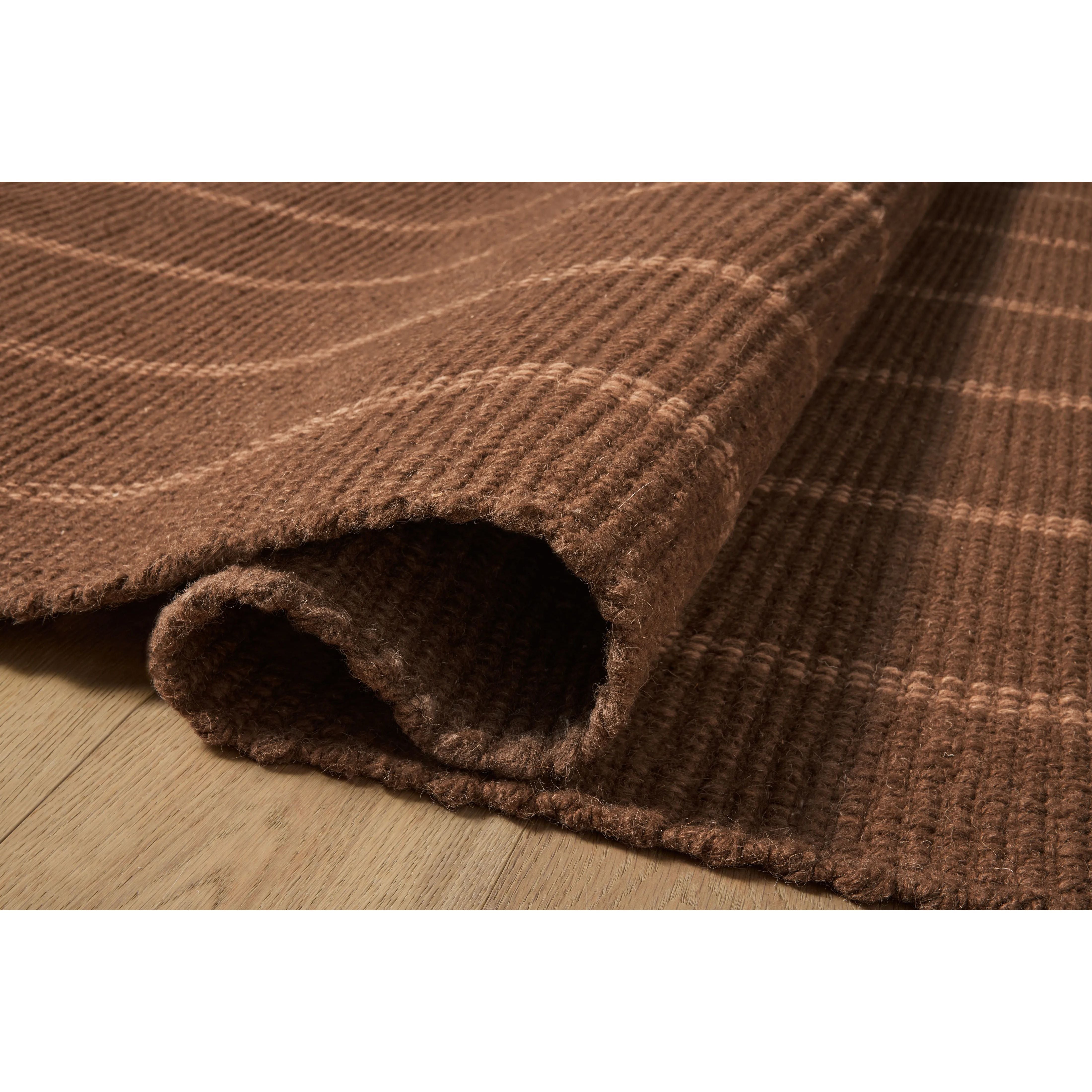 The Harlan Collection by Amber Lewis x Loloi is a classic striped flatweave area rug in the interior designer’s signature warm, earthy tones. The rug has a chunky wool pile with whipstitch borders that add character and natural texture to living rooms, bedrooms, and other well-loved areas of the home. Amethyst Home provides interior design, new home construction design consulting, vintage area rugs, and lighting in the Omaha metro area.