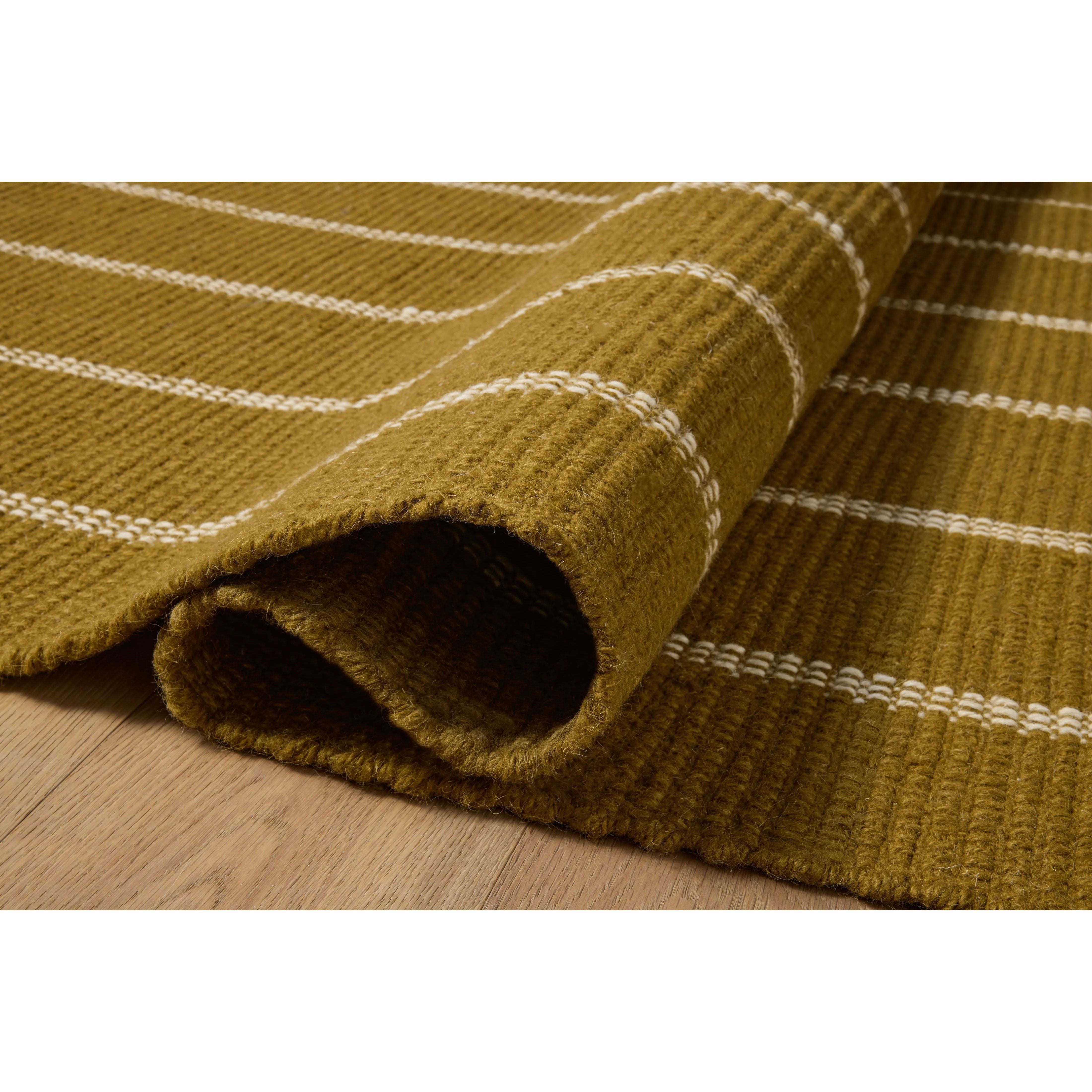 The Harlan Collection by Amber Lewis x Loloi is a classic striped flatweave area rug in the interior designer’s signature warm, earthy tones. The rug has a chunky wool pile with whipstitch borders that add character and natural texture to living rooms, bedrooms, and other well-loved areas of the home. Amethyst Home provides interior design, new home construction design consulting, vintage area rugs, and lighting in the Omaha metro area.