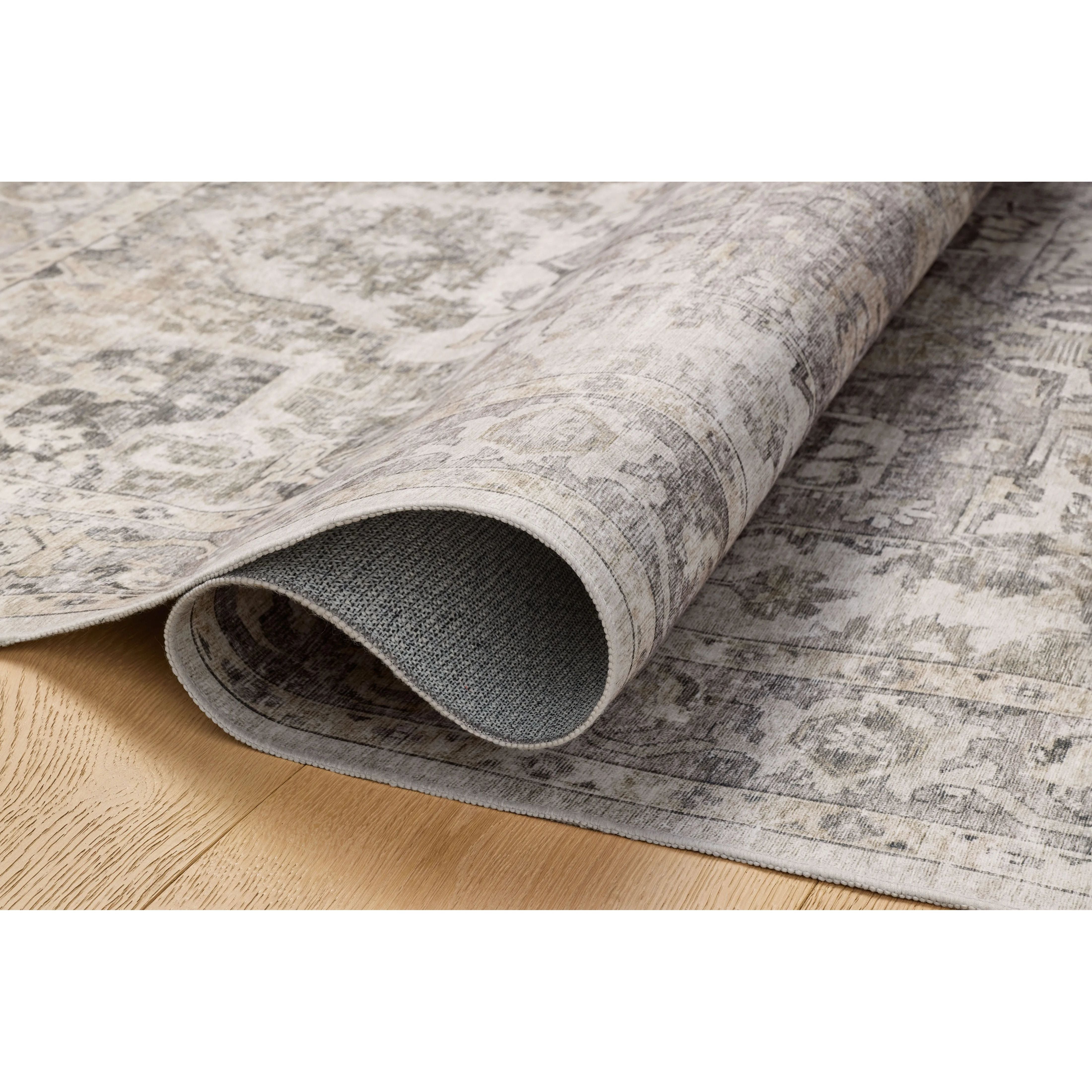 Featuring Amber Lewis x Loloi Josie Silver / Natural Rug by Loloi at Amethyst Home. The Josie Collection is a machine-washable area rug with an exceptional design by Amber Lewis x Loloi. The rugs beautiful, vintage-inspired motifs in rich, earthy tones raise the standard for washable rugs. This collection is power-loomed of polyester in China and OEKO-TEX cert. Amethyst Home provides interior design, new home construction design consulting, vintage area rugs, and lighting in the Boston metro area.