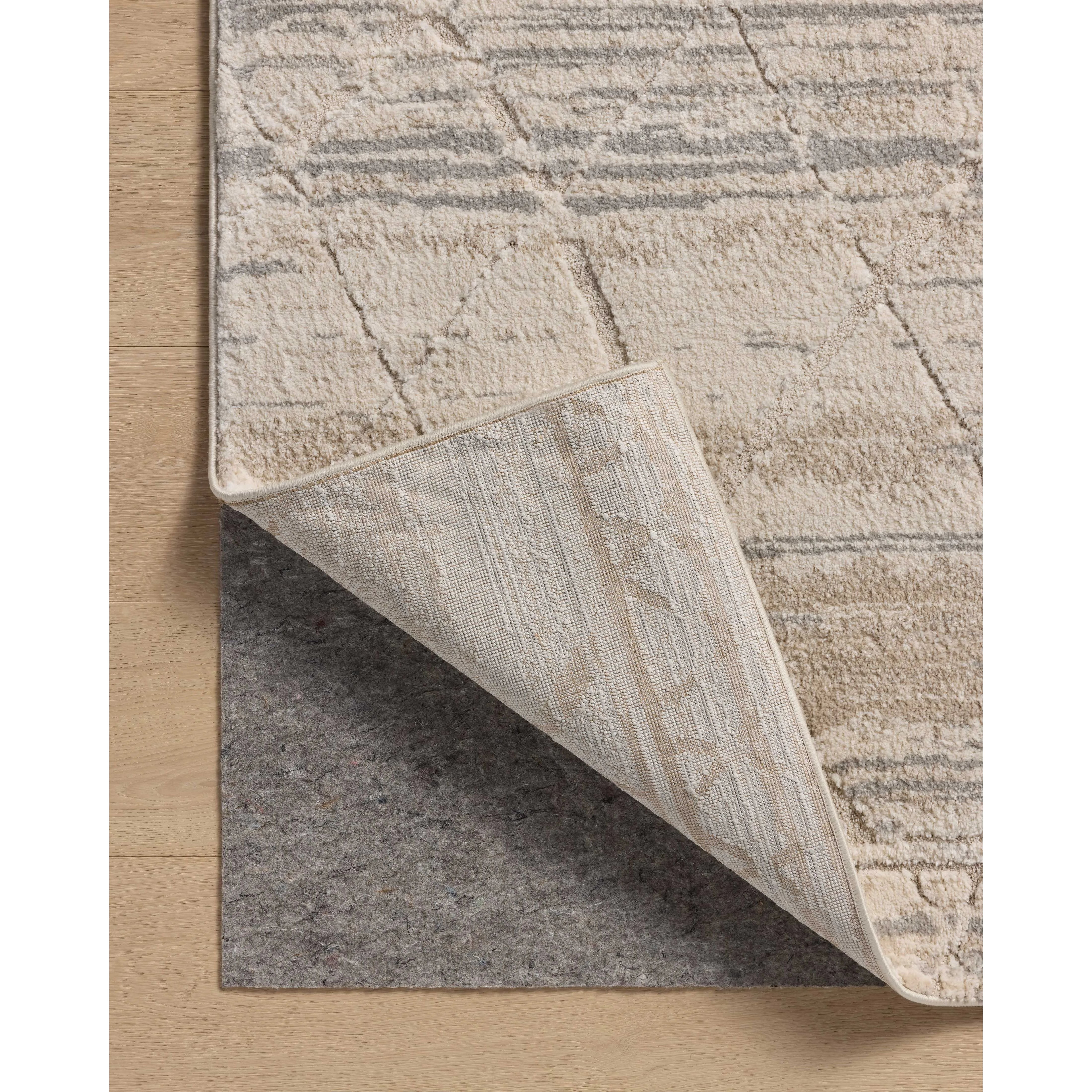 Featuring Amber Lewis x Loloi Monty Ivory / Natural Rug by Loloi at Amethyst Home. The Monty Collection by Amber Lewis x Loloi is a modern interpretation of richly piled Moroccan rugs in a refreshingly neutral color palette. The rugs abstract designs create a high-low texture in the pile for feet to sink into. This collection is power-loomed of easy-to-clean p. Amethyst Home provides interior design, new home construction design consulting, vintage area rugs, and lighting in the Austin metro area.