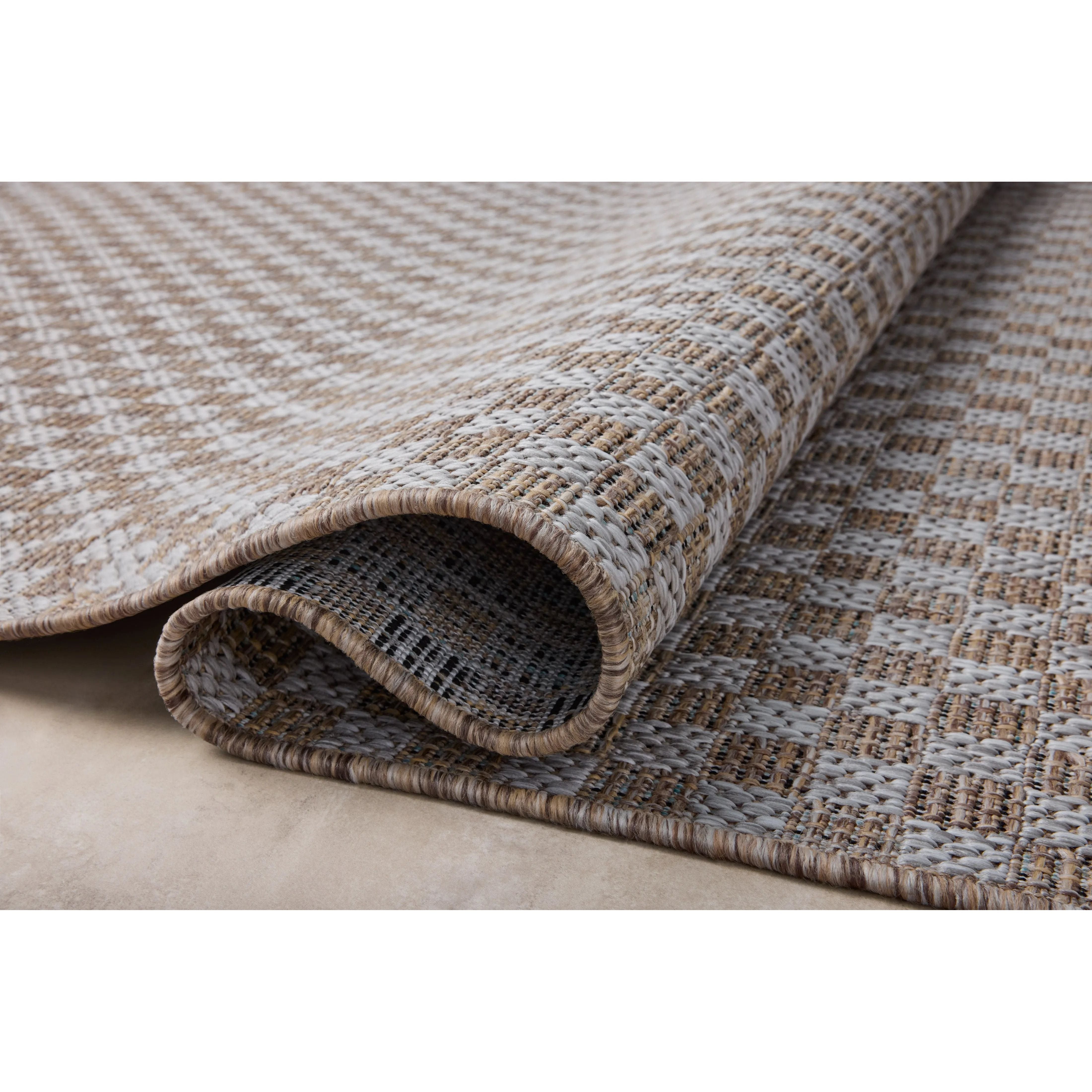 Featuring Amber Lewis x Loloi Topanga Natural / Silver Rug by Loloi at Amethyst Home. Inspired by the scenic mountain town in California, the Topanga Collection is an indoor/outdoor rug made of durable polypropylene that resembles natural fibers but is much more ready for sun, rain, and high-traffic use. The rug's modern construction also makes it easy to clea. Amethyst Home provides interior design, new home construction design consulting, vintage area rugs, and lighting in the Austin metro area.