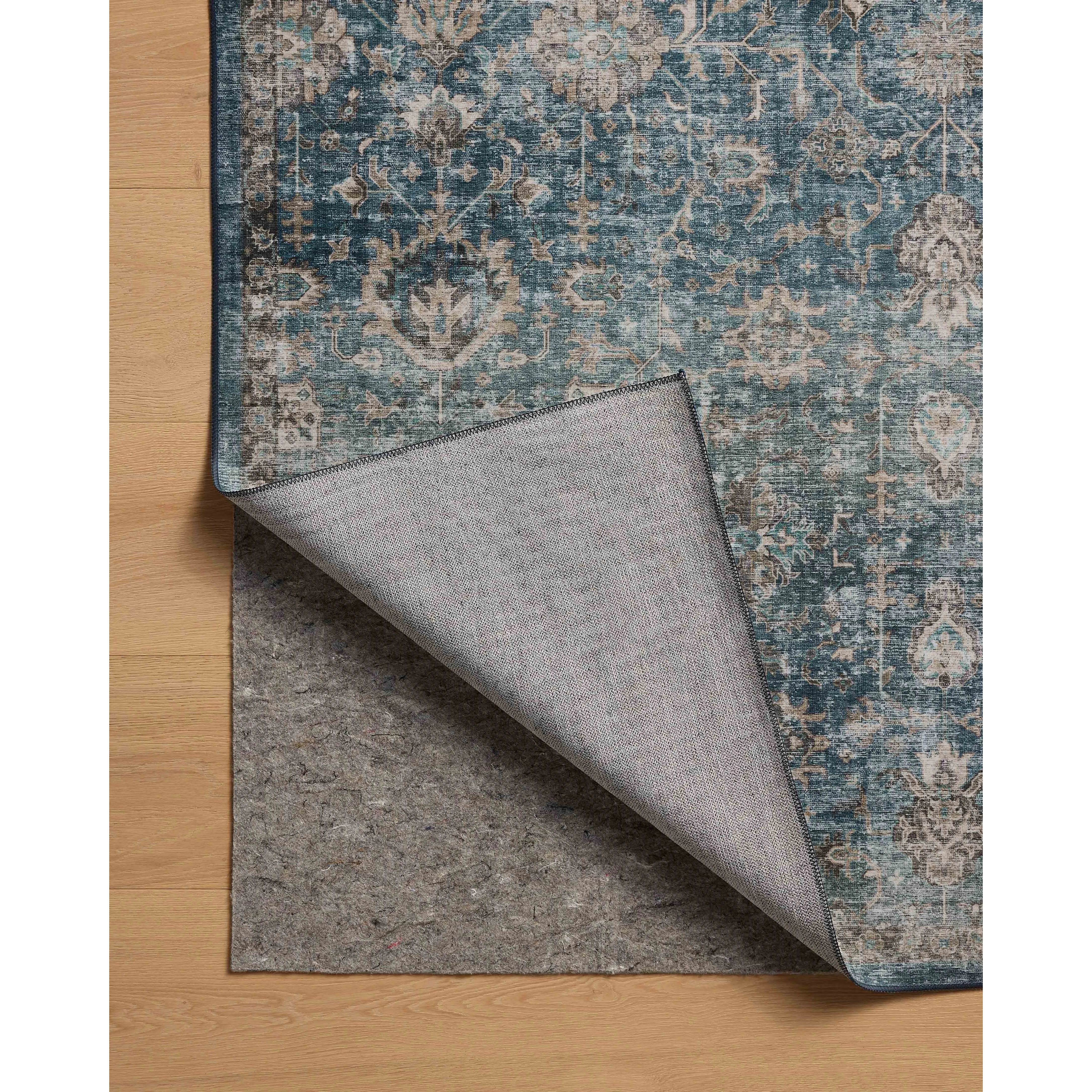 Featuring Anniston Machine Washable Lagoon / Natural Rug by Loloi at Amethyst Home. The Anniston Collection is a washable rug with traditional motifs in beautifully saturated and distressed tones. This durable area rug is power-loomed of polyester in China and designed for the busiest rooms of the home—living rooms, bedrooms, kitchens, hallways, and more. I. Amethyst Home provides interior design, new home construction design consulting, vintage area rugs, and lighting in the Calabasas metro area.
