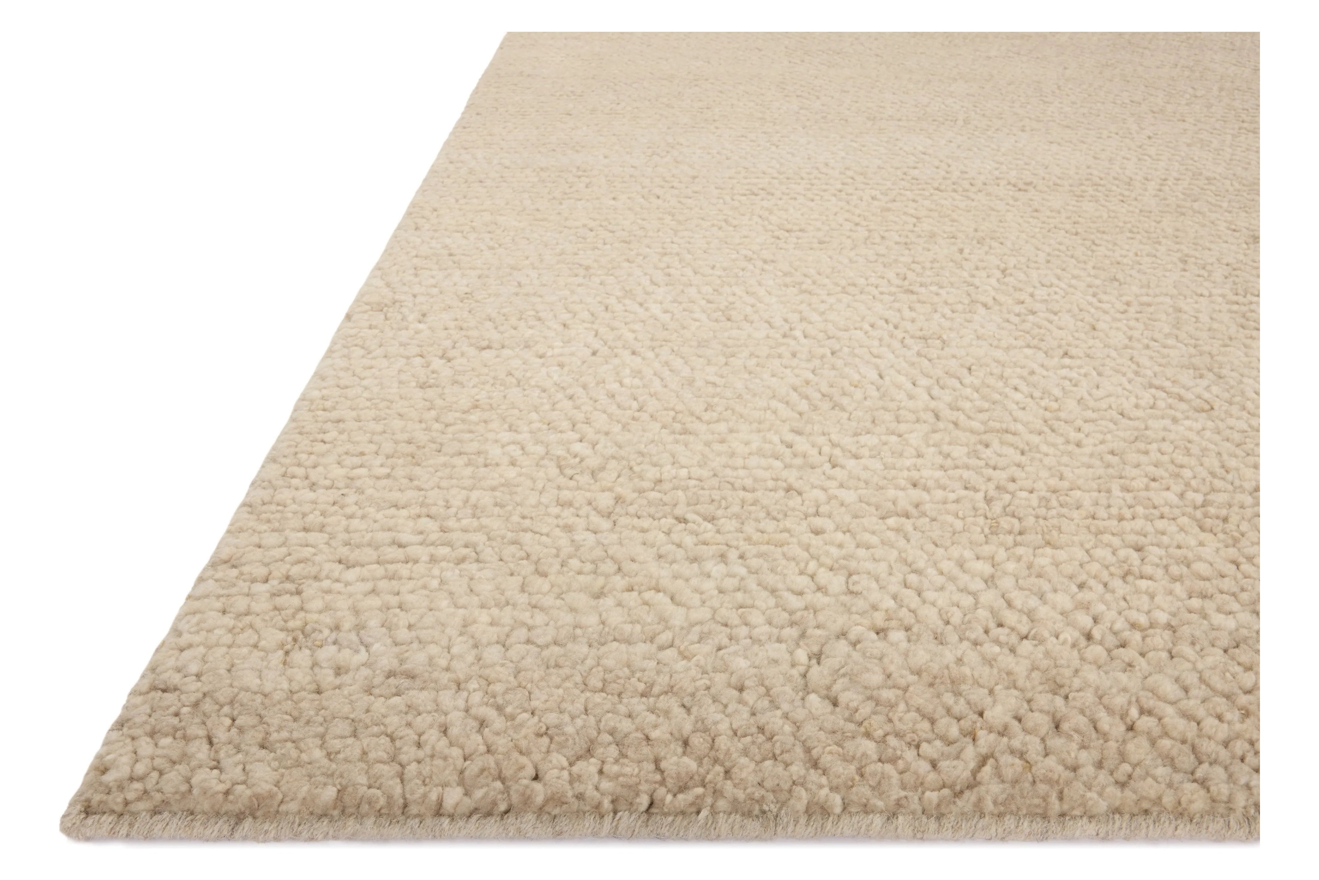With versatile earth tones and a chunky, hand-knotted texture resembling tiny pebbles, the Frida Bone Rug by Brigette Romanek x Loloi can ground any room with a sense of elevated ease. Each area rug features a subtle nuance in color variation due to the handmade nature of its construction and has a pleasantly nubby softness underfoot. Amethyst Home provides interior design, new home construction design consulting, vintage area rugs, and lighting in the Calabasas metro area.