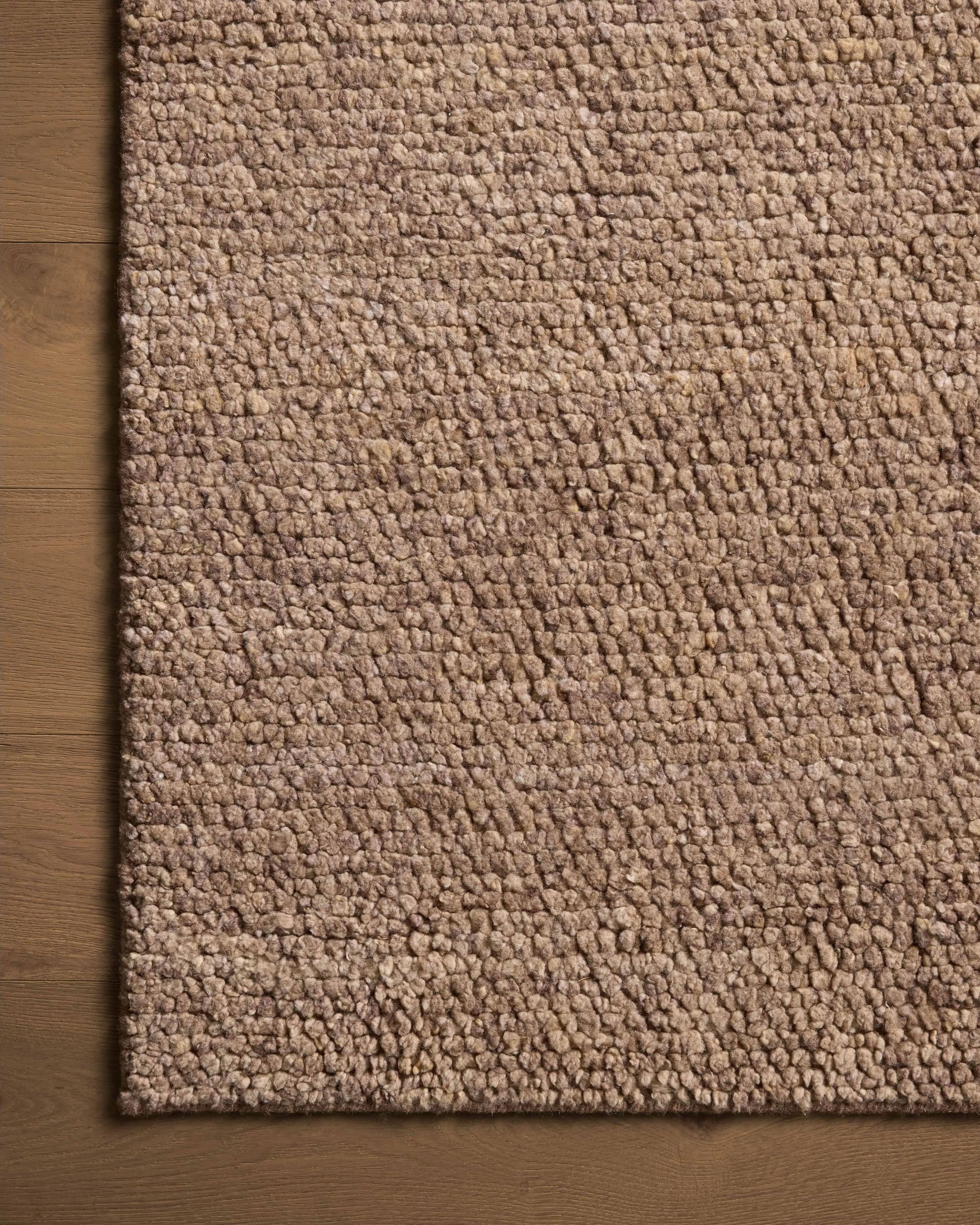 With versatile earth tones and a chunky, hand-knotted texture resembling tiny pebbles, the Frida Dark Taupe Rug by Brigette Romanek x Loloi can ground any room with a sense of elevated ease. Each area rug features a subtle nuance in color variation due to the handmade nature of its construction and has a pleasantly nubby softness underfoot. Amethyst Home provides interior design, new home construction design consulting, vintage area rugs, and lighting in the Des Moines metro area.