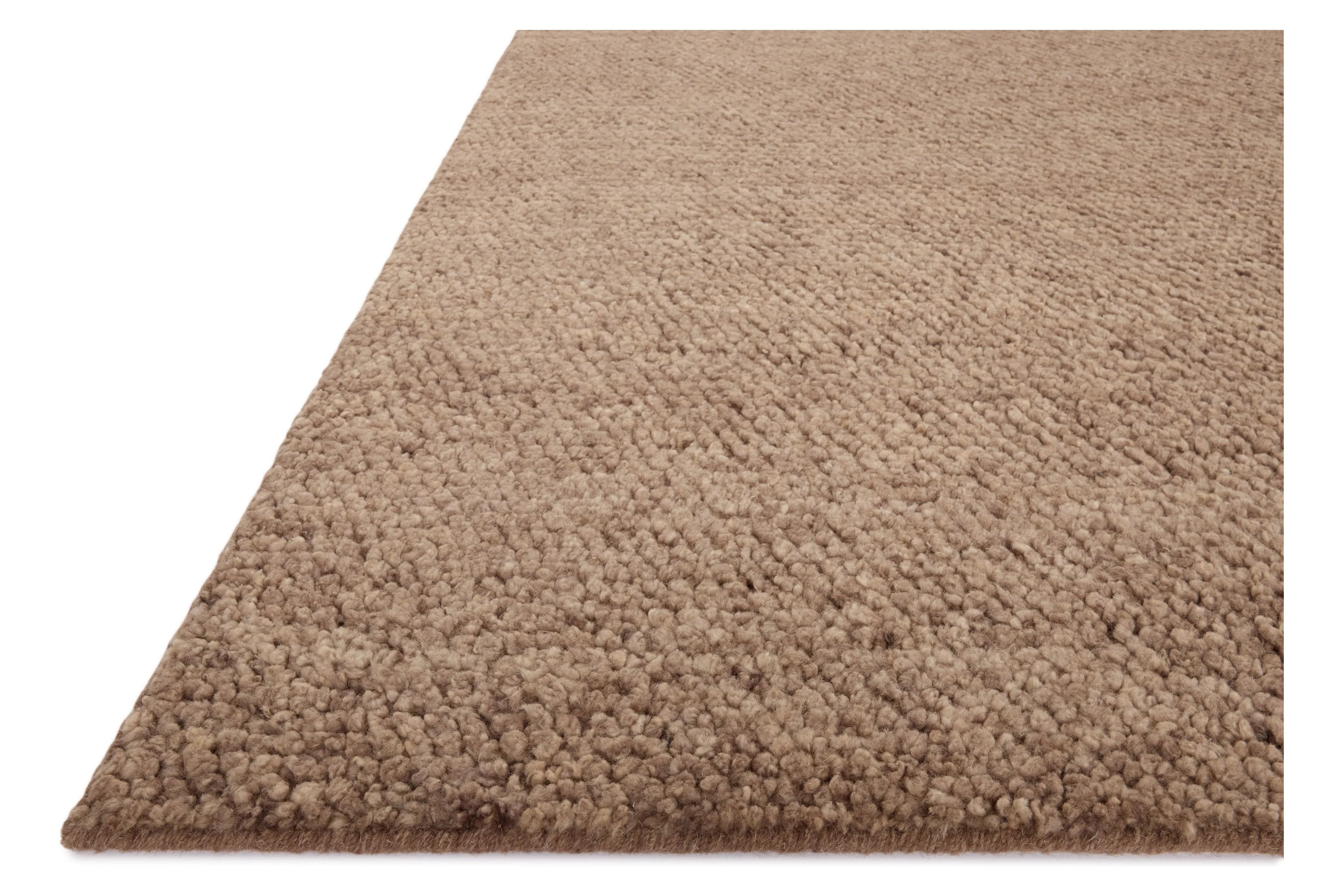 With versatile earth tones and a chunky, hand-knotted texture resembling tiny pebbles, the Frida Dark Taupe Rug by Brigette Romanek x Loloi can ground any room with a sense of elevated ease. Each area rug features a subtle nuance in color variation due to the handmade nature of its construction and has a pleasantly nubby softness underfoot. Amethyst Home provides interior design, new home construction design consulting, vintage area rugs, and lighting in the Scottsdale metro area.