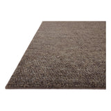 With versatile earth tones and a chunky, hand-knotted texture resembling tiny pebbles, the Frida Graphite Rug by Brigette Romanek x Loloi can ground any room with a sense of elevated ease. Each area rug features a subtle nuance in color variation due to the handmade nature of its construction and has a pleasantly nubby softness underfoot. Amethyst Home provides interior design, new home construction design consulting, vintage area rugs, and lighting in the Charlotte metro area.