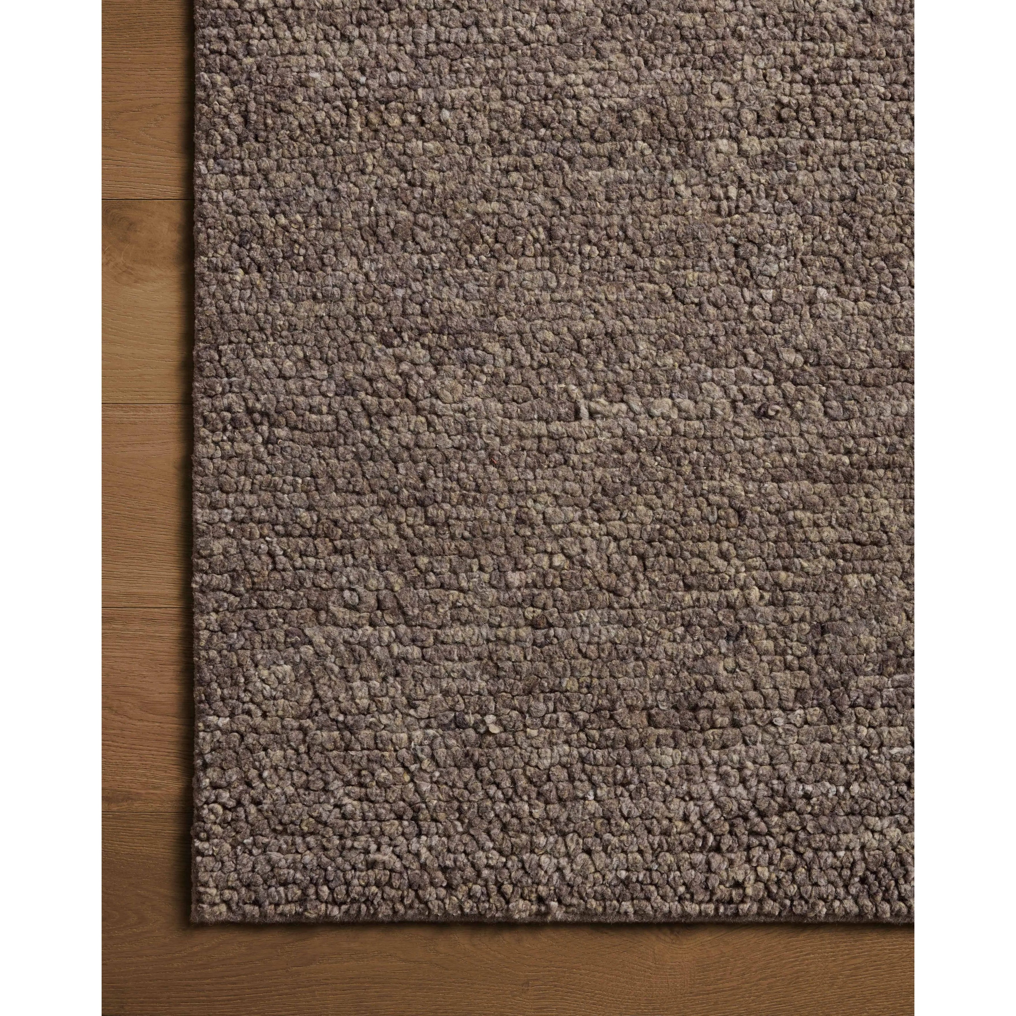 With versatile earth tones and a chunky, hand-knotted texture resembling tiny pebbles, the Frida Graphite Rug by Brigette Romanek x Loloi can ground any room with a sense of elevated ease. Each area rug features a subtle nuance in color variation due to the handmade nature of its construction and has a pleasantly nubby softness underfoot. Amethyst Home provides interior design, new home construction design consulting, vintage area rugs, and lighting in the Washington metro area.