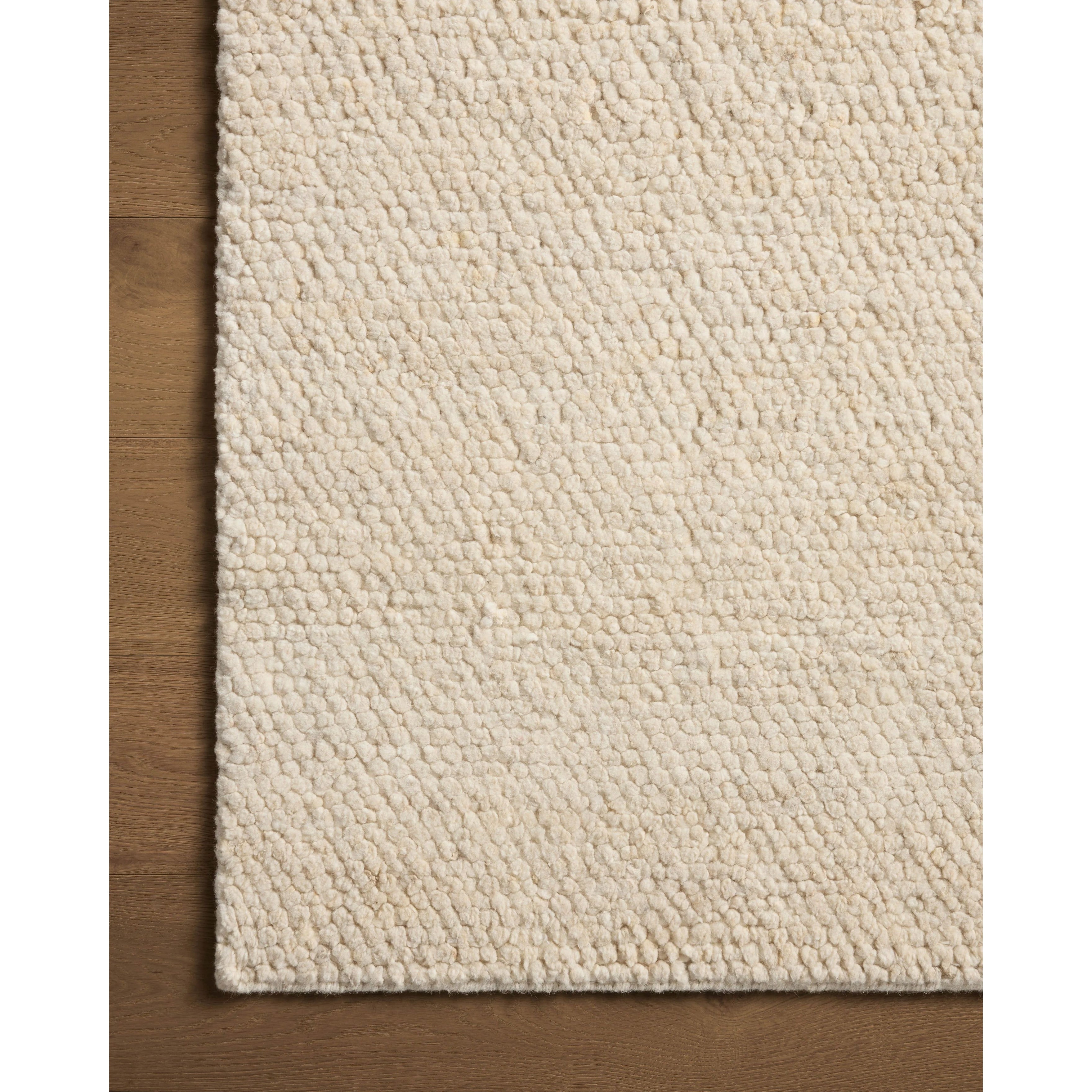 With versatile earth tones and a chunky, hand-knotted texture resembling tiny pebbles, the Frida Natural Rug by Brigette Romanek x Loloi can ground any room with a sense of elevated ease. Each area rug features a subtle nuance in color variation due to the handmade nature of its construction and has a pleasantly nubby softness underfoot. Amethyst Home provides interior design, new home construction design consulting, vintage area rugs, and lighting in the Monterey metro area.