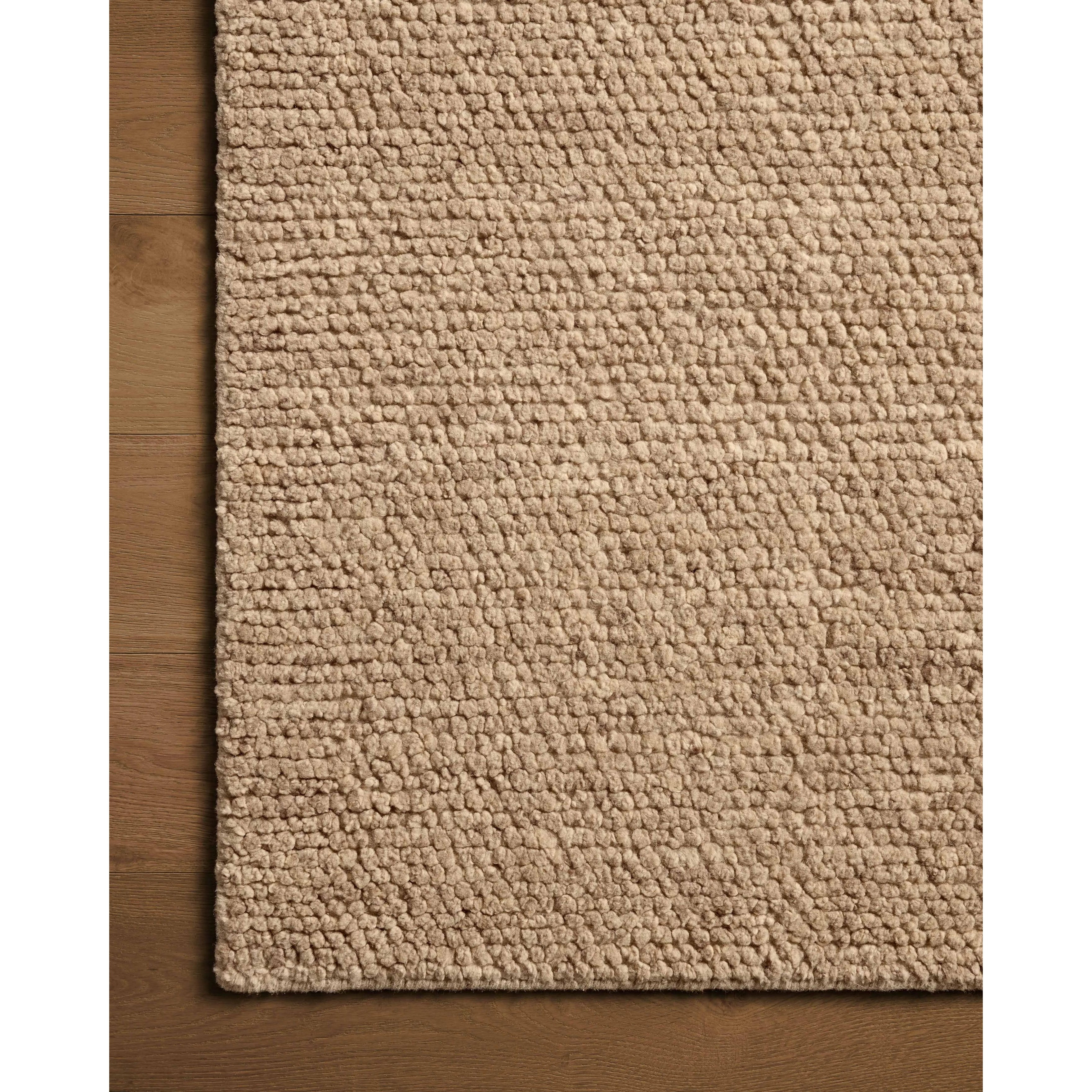 With versatile earth tones and a chunky, hand-knotted texture resembling tiny pebbles, the Frida Sand Rug by Brigette Romanek x Loloi can ground any room with a sense of elevated ease. Each area rug features a subtle nuance in color variation due to the handmade nature of its construction and has a pleasantly nubby softness underfoot. Amethyst Home provides interior design, new home construction design consulting, vintage area rugs, and lighting in the San Diego metro area.