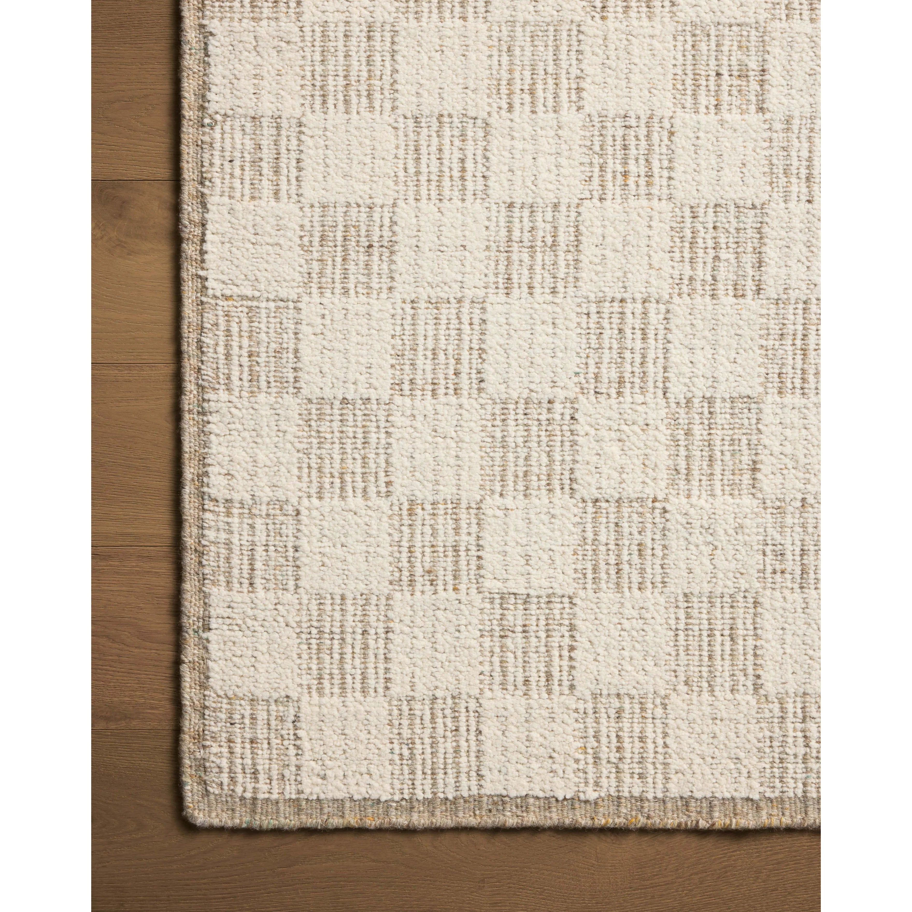 The Knox Ivory / Khaki Rug by Brigette Romanek x Loloi is a handwoven area rug with a contemporary checkerboard pattern and a texture reminiscent of a luxurious knit sweater. Made of a blend of wool and cotton that plays with scale and texture, Knox is imbued with cozy luxury that can anchor any room. Amethyst Home provides interior design, new home construction design consulting, vintage area rugs, and lighting in the Salt Lake City metro area.