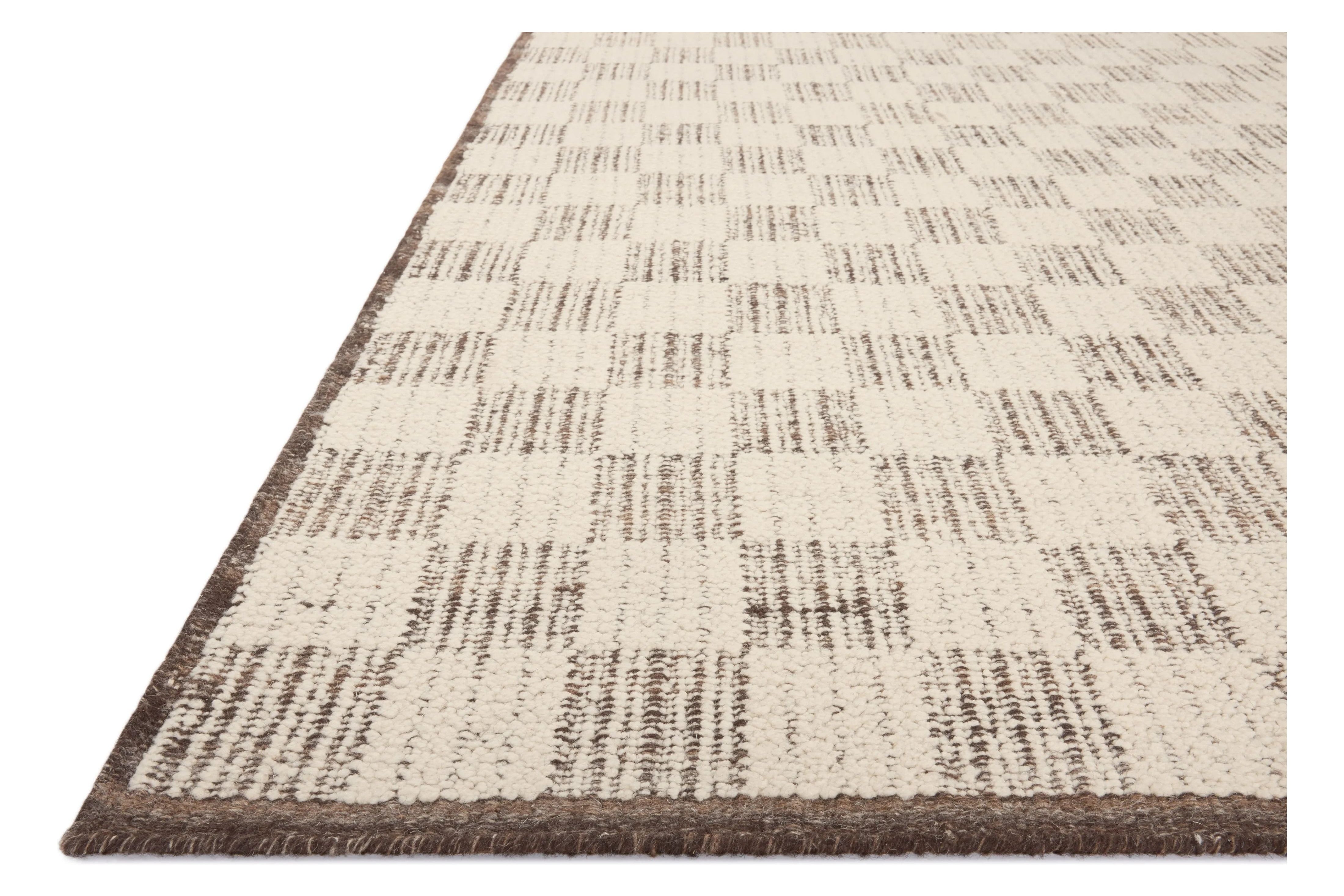 The Knox Ivory / Mocha Rug by Brigette Romanek x Loloi is a handwoven area rug with a contemporary checkerboard pattern and a texture reminiscent of a luxurious knit sweater. Made of a blend of wool and cotton that plays with scale and texture, Knox is imbued with cozy luxury that can anchor any room. Amethyst Home provides interior design, new home construction design consulting, vintage area rugs, and lighting in the Salt Lake City metro area.