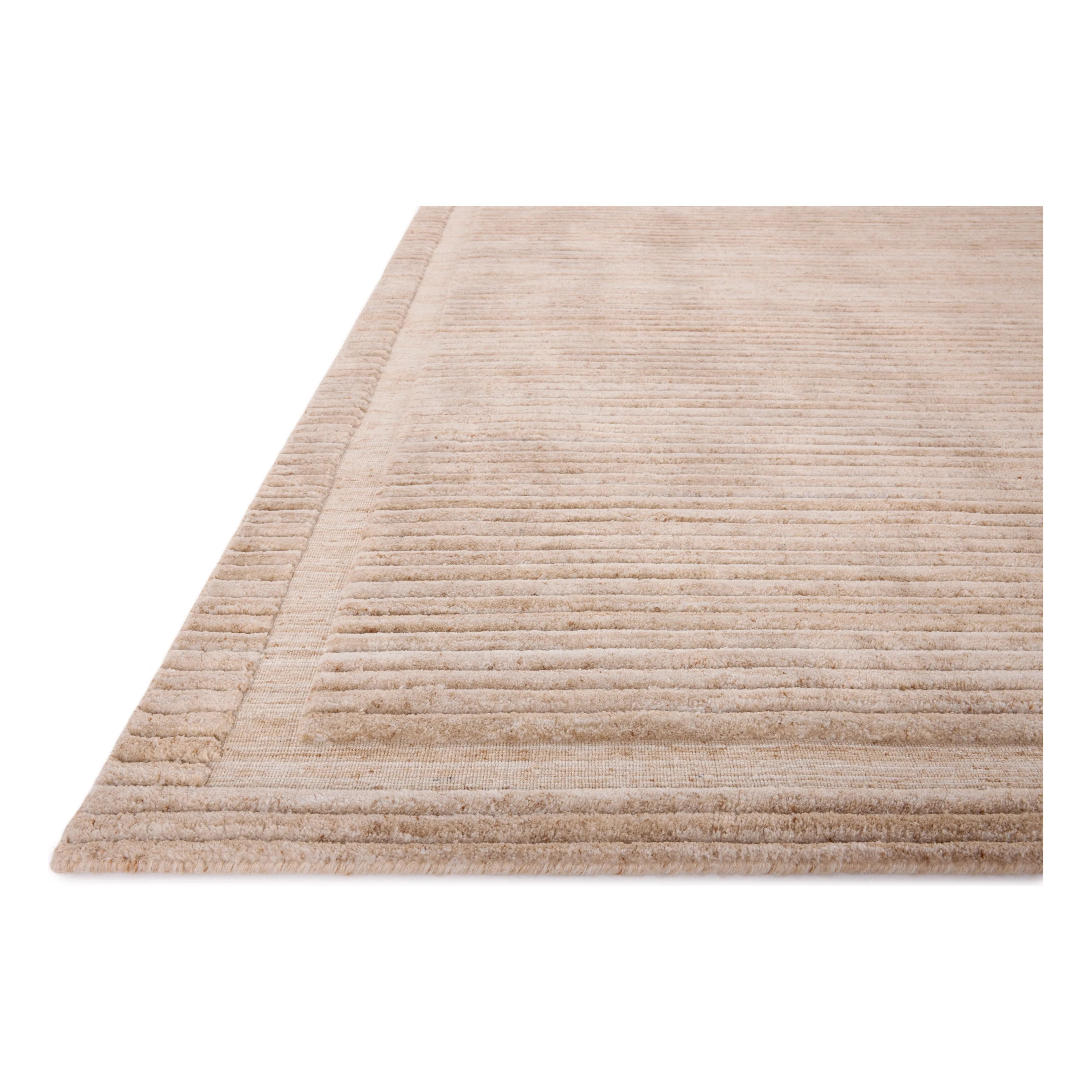 Featuring Brigette Romanek x Loloi Orly Clay Rug by Loloi at Amethyst Home. Irresistible to walk upon, the Dana Clay Rug by Brigette Romanek x Loloi has a high-low texture that alternates between a subtly shaggy pile and a soft base. Horizontal broken stripes give the area rug a fresh and energized structure, while a finish of fringe along the edges accent. Amethyst Home provides interior design, new home construction design consulting, vintage area rugs, and lighting in the Alpharetta metro area.