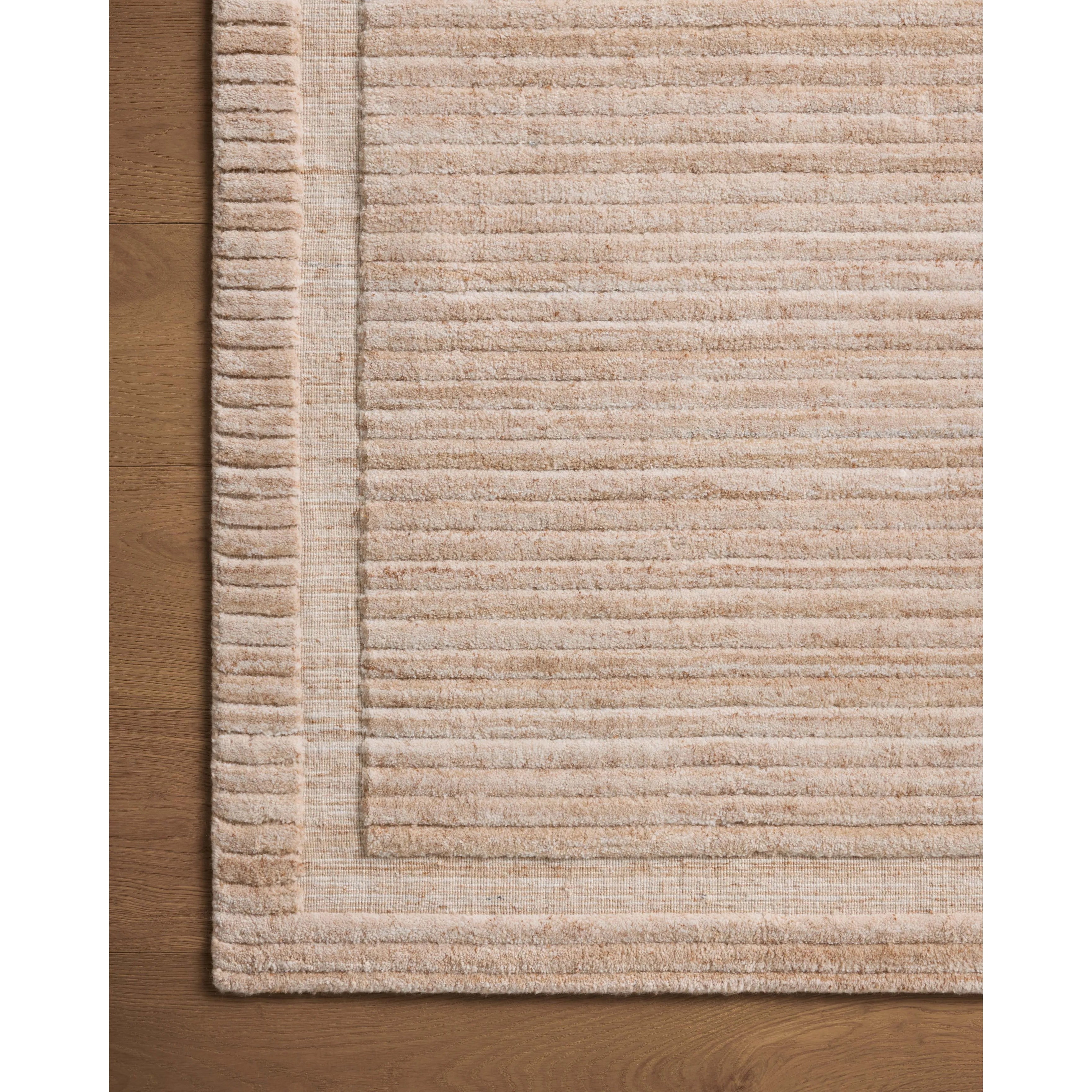 Irresistible to walk upon, the Dana Clay Rug by Brigette Romanek x Loloi has a high-low texture that alternates between a subtly shaggy pile and a soft base. Horizontal broken stripes give the area rug a fresh and energized structure, while a finish of fringe along the edges accentuates its sense of movement. Amethyst Home provides interior design, new home construction design consulting, vintage area rugs, and lighting in the Houston metro area.