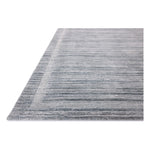 Irresistible to walk upon, the Dana Denim Rug by Brigette Romanek x Loloi has a high-low texture that alternates between a subtly shaggy pile and a soft base. Horizontal broken stripes give the area rug a fresh and energized structure, while a finish of fringe along the edges accentuates its sense of movement. Amethyst Home provides interior design, new home construction design consulting, vintage area rugs, and lighting in the Alpharetta metro area.