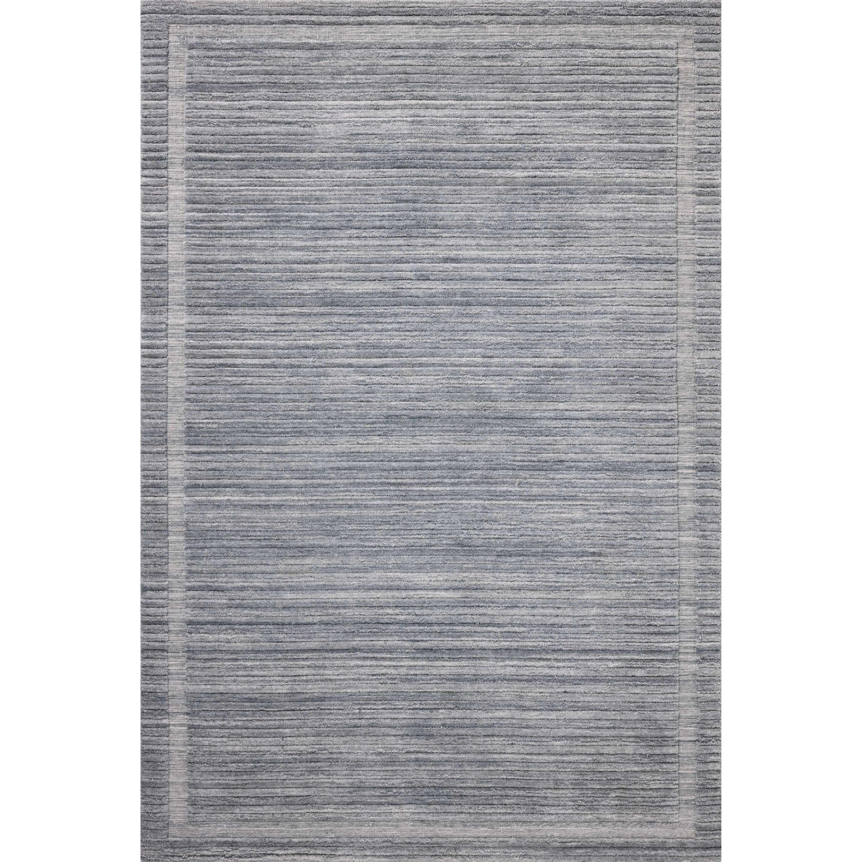 Irresistible to walk upon, the Dana Denim Rug by Brigette Romanek x Loloi has a high-low texture that alternates between a subtly shaggy pile and a soft base. Horizontal broken stripes give the area rug a fresh and energized structure, while a finish of fringe along the edges accentuates its sense of movement. Amethyst Home provides interior design, new home construction design consulting, vintage area rugs, and lighting in the Portland metro area.