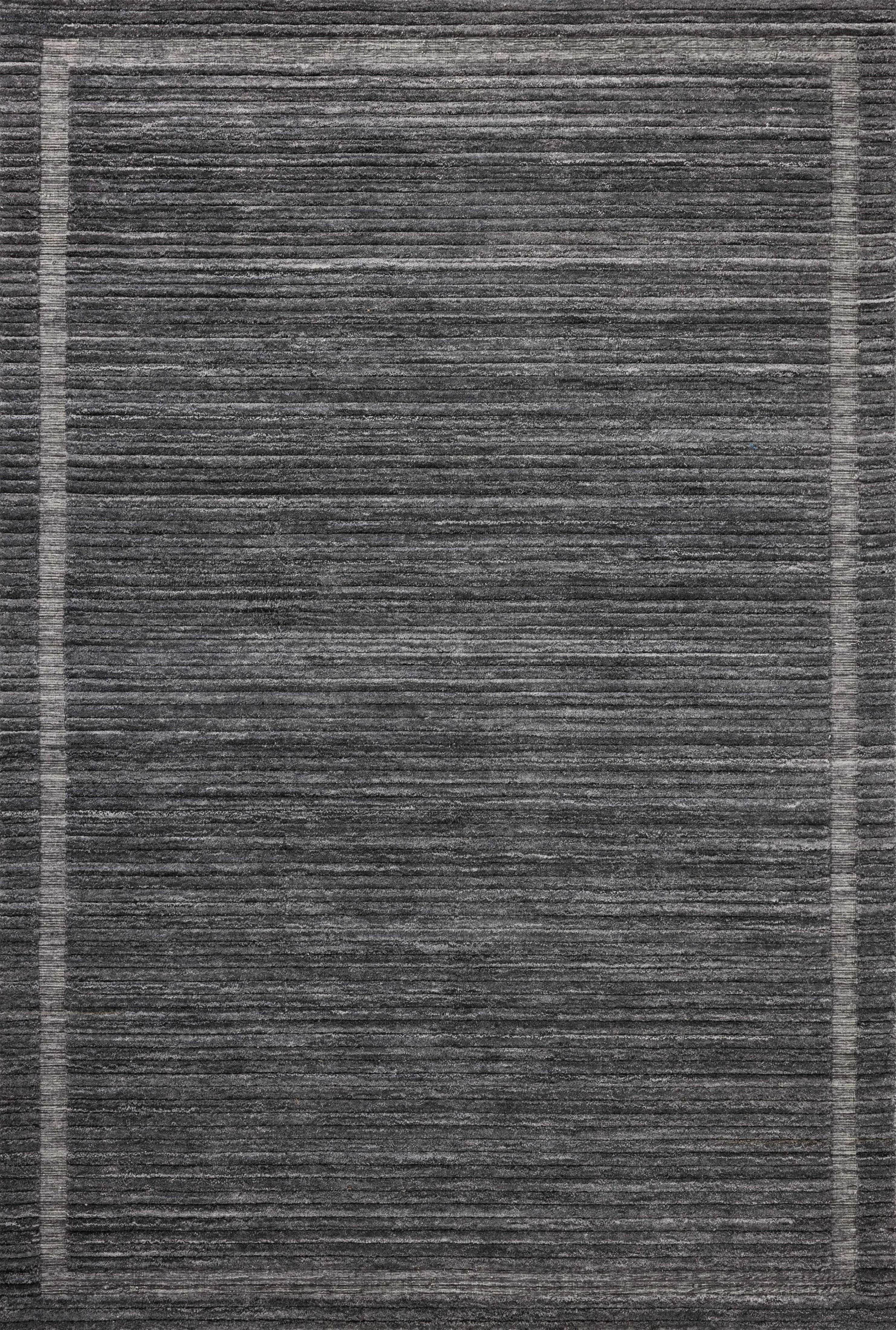 Irresistible to walk upon, the Dana Ink Rug by Brigette Romanek x Loloi has a high-low texture that alternates between a subtly shaggy pile and a soft base. Horizontal broken stripes give the area rug a fresh and energized structure, while a finish of fringe along the edges accentuates its sense of movement. Amethyst Home provides interior design, new home construction design consulting, vintage area rugs, and lighting in the San Diego metro area.