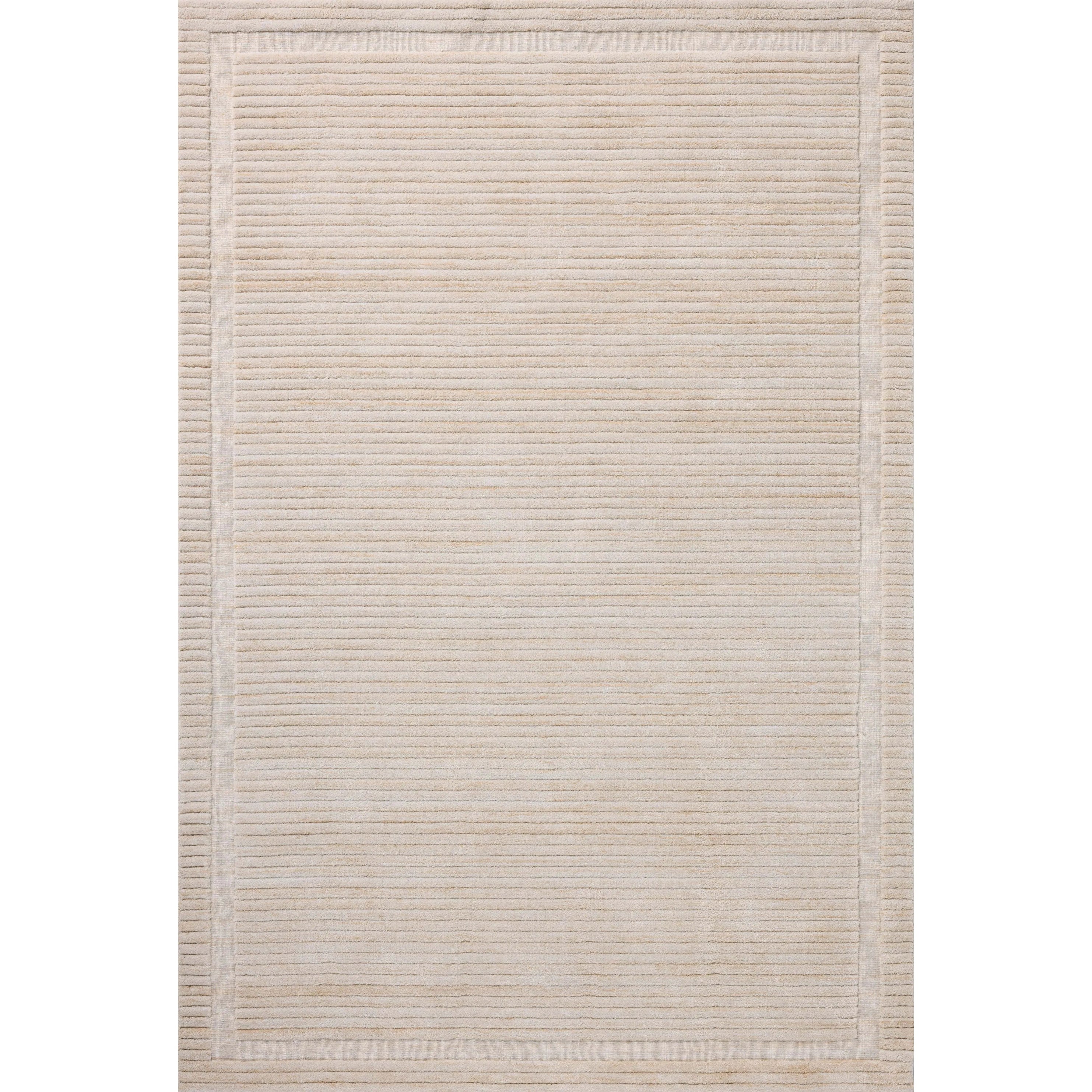 Irresistible to walk upon, the Dana Natural Rug by Brigette Romanek x Loloi has a high-low texture that alternates between a subtly shaggy pile and a soft base. Horizontal broken stripes give the area rug a fresh and energized structure, while a finish of fringe along the edges accentuates its sense of movement. Amethyst Home provides interior design, new home construction design consulting, vintage area rugs, and lighting in the Portland metro area.