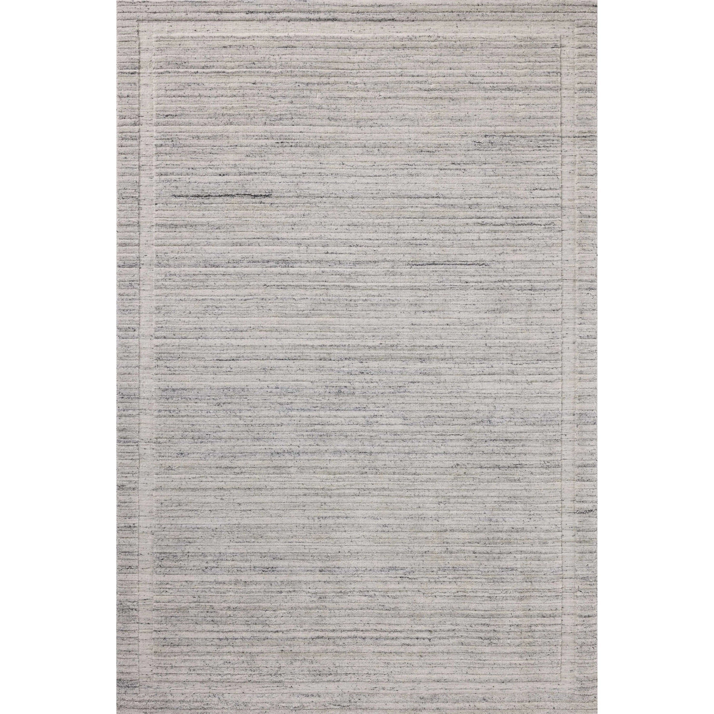 Irresistible to walk upon, the Dana Stone Rug by Brigette Romanek x Loloi has a high-low texture that alternates between a subtly shaggy pile and a soft base. Horizontal broken stripes give the area rug a fresh and energized structure, while a finish of fringe along the edges accentuates its sense of movement. Amethyst Home provides interior design, new home construction design consulting, vintage area rugs, and lighting in the Miami metro area.