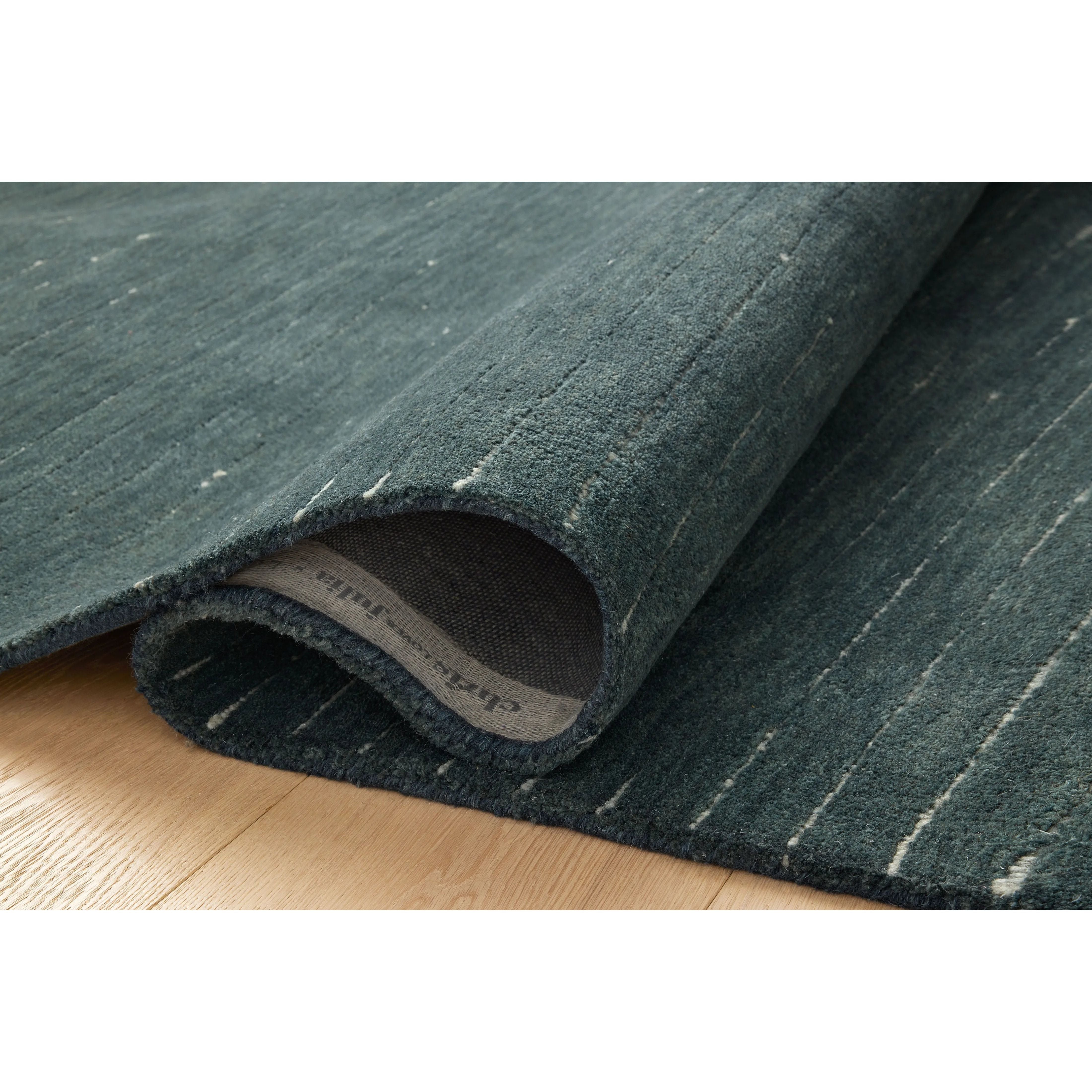 Featuring Chris Loves Julia × Loloi Henry Denim / Ivory Rug by Loloi at Amethyst Home. The Henry Collection from Chris Loves Julia x Loloi is a hand-tufted area rug that adds a touch of personality to a solid-colored design that can easily pair with other patterns in the room. These designs feature tufted stripes for subtle contrast and depth. The rugs wool . Amethyst Home provides interior design, new home construction design consulting, vintage area rugs, and lighting in the Monterey metro area.