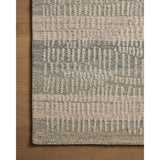 The Elias Earth / Blush Rug is a hand-tufted wool area rug with lively graphic patterns in earth and stone tones. There’s a unique texture to the rug made by over-tufting, in which a design is hand-tufted over a tufted base, creating a subtle high-low pile. Amethyst Home provides interior design, new home construction design consulting, vintage area rugs, and lighting in the Tampa metro area.