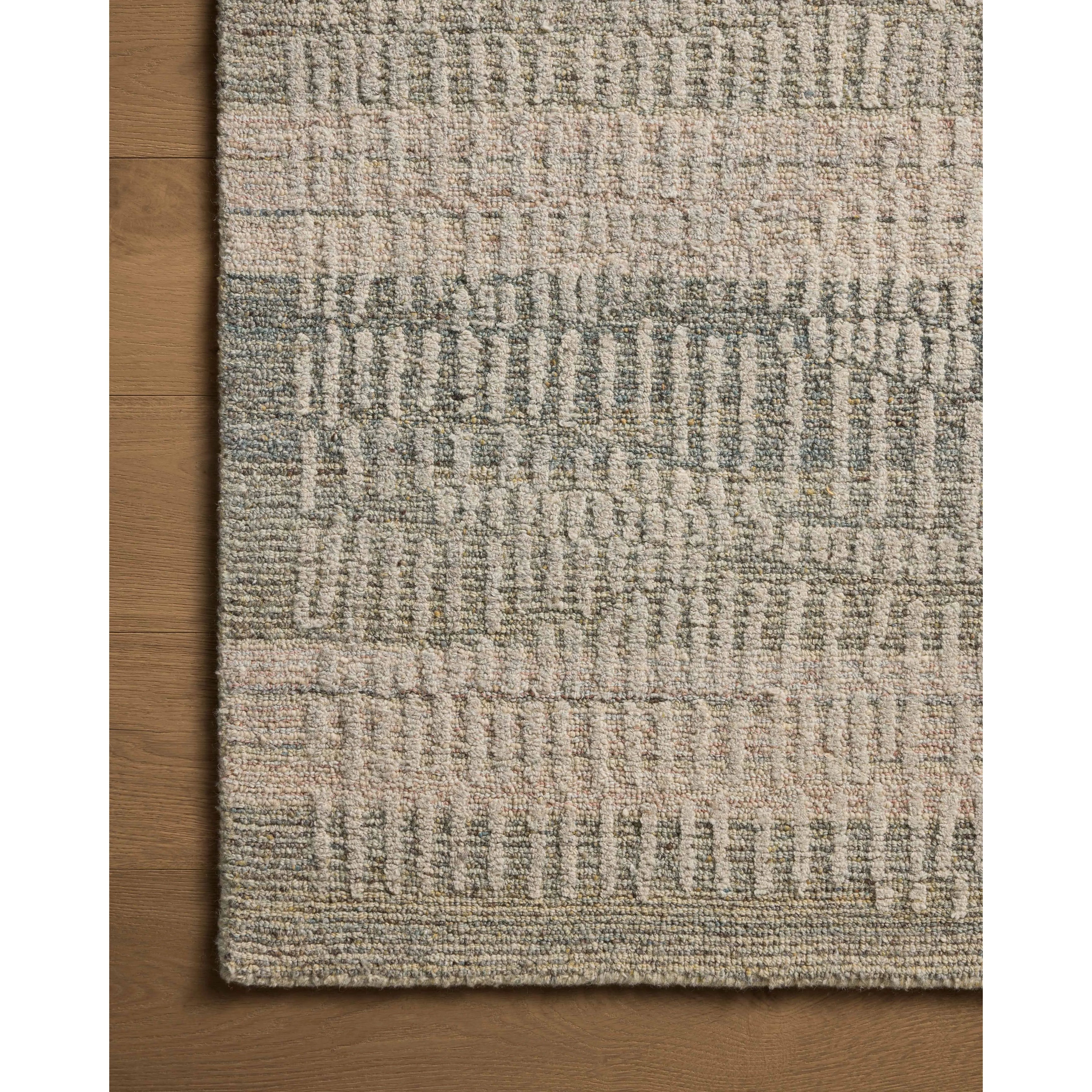 The Elias Earth / Blush Rug is a hand-tufted wool area rug with lively graphic patterns in earth and stone tones. There’s a unique texture to the rug made by over-tufting, in which a design is hand-tufted over a tufted base, creating a subtle high-low pile. Amethyst Home provides interior design, new home construction design consulting, vintage area rugs, and lighting in the Tampa metro area.