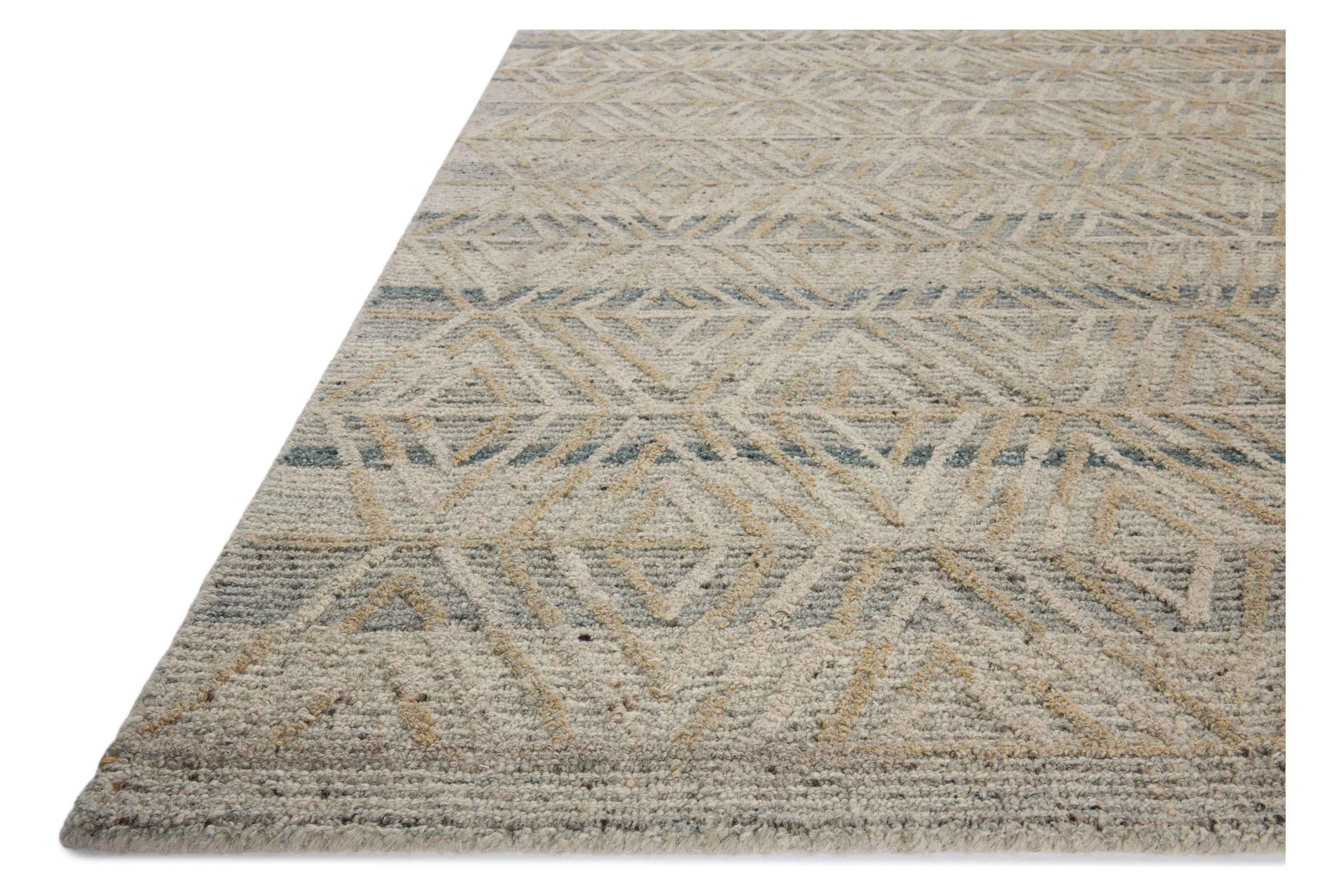 The Elias Fog / Natural Rug is a hand-tufted wool area rug with lively graphic patterns in earth and stone tones. There’s a unique texture to the rug made by over-tufting, in which a design is hand-tufted over a tufted base, creating a subtle high-low pile. Amethyst Home provides interior design, new home construction design consulting, vintage area rugs, and lighting in the Portland metro area.