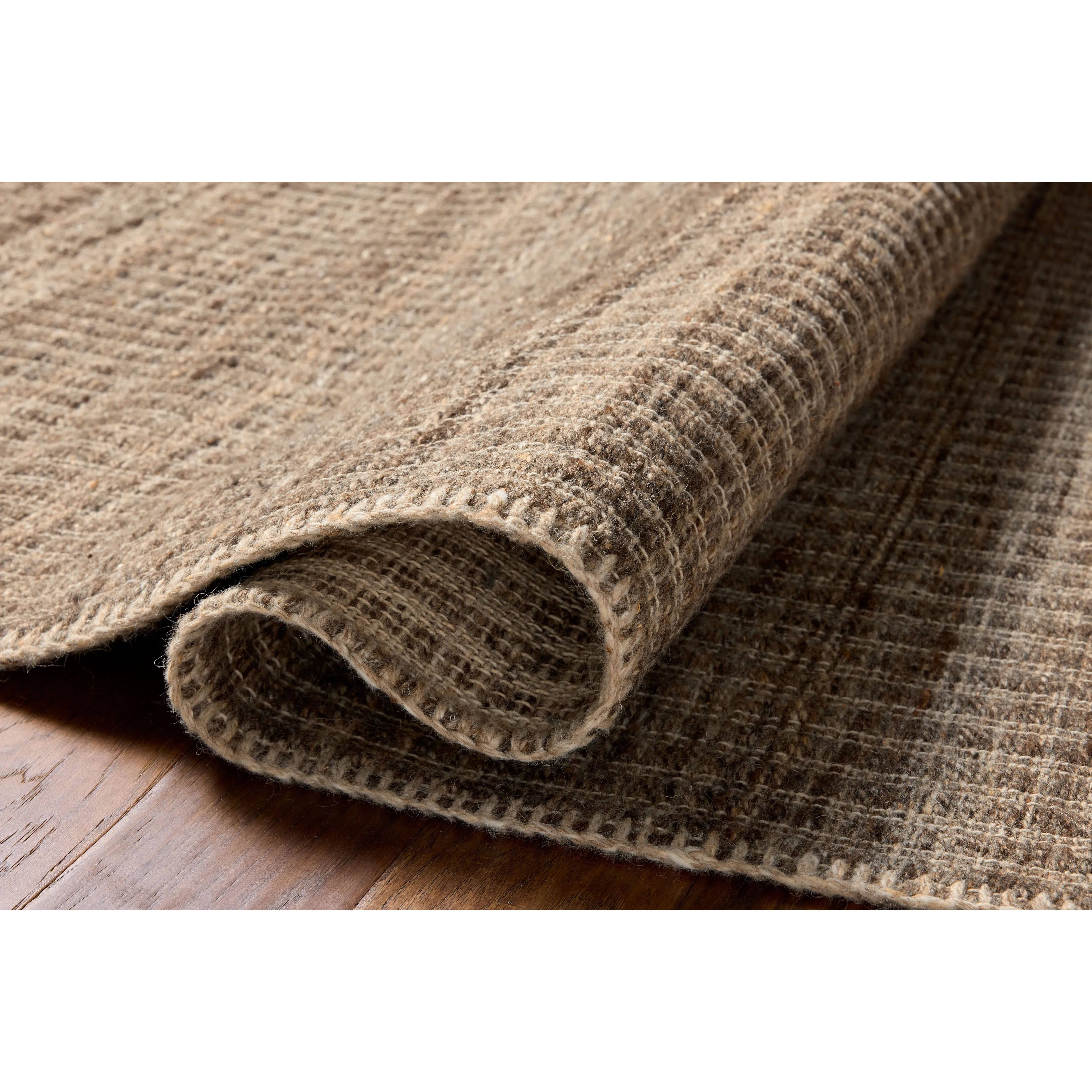 The Elma Collection is a vertically striped area rug framed with whip-stitched edges to help ground your space. This timeless, neutral rug is great for high-traffic living rooms, bedrooms, and dining rooms of many home decor styles. Amethyst Home provides interior design, new home construction design consulting, vintage area rugs, and lighting in the Des Moines metro area.