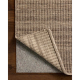 The Elma Collection is a vertically striped area rug framed with whip-stitched edges to help ground your space. This timeless, neutral rug is great for high-traffic living rooms, bedrooms, and dining rooms of many home decor styles. Amethyst Home provides interior design, new home construction design consulting, vintage area rugs, and lighting in the San Diego metro area.