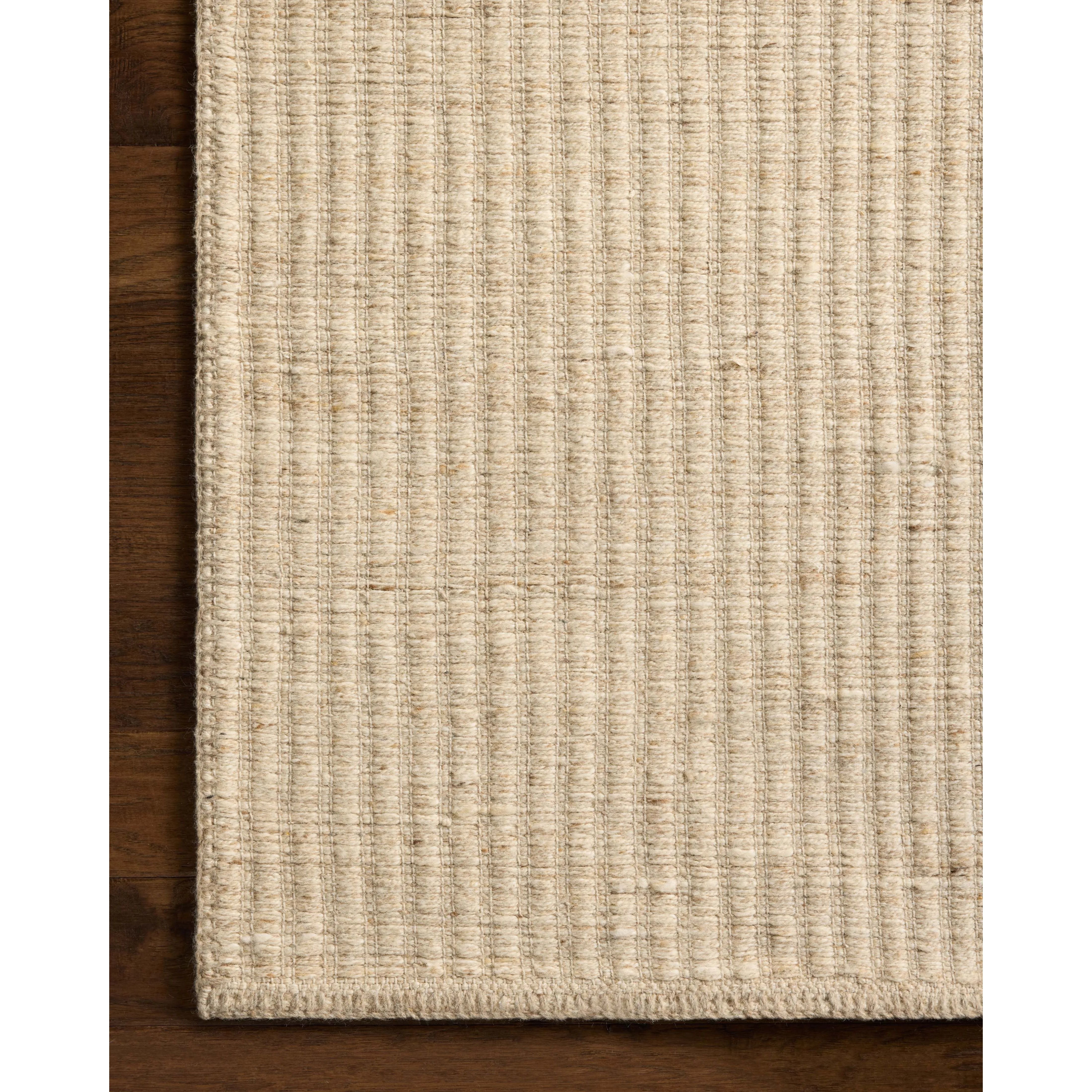 The Elma Collection is a vertically striped area rug framed with whip-stitched edges to help ground your space. This timeless, neutral rug is great for high-traffic living rooms, bedrooms, and dining rooms of many home decor styles. Amethyst Home provides interior design, new home construction design consulting, vintage area rugs, and lighting in the Des Moines metro area.