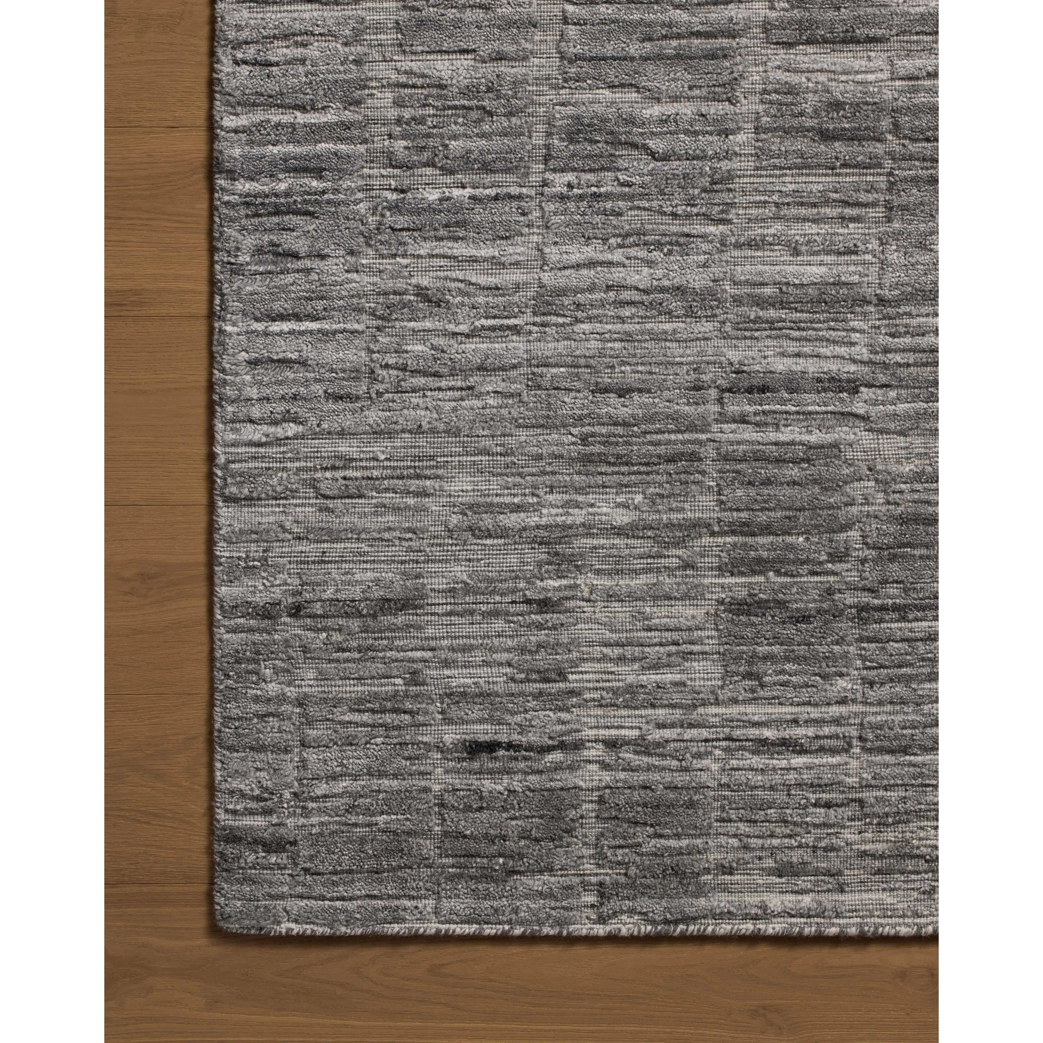 Area rugs in the Daniel Slate Rug have a graphic design in a range of tonal palettes with a soft, gently ribbed texture. The hand-loomed pile is a blend of bamboo and wool with a slight sheen that captures the light and changes the rug’s sense of depth throughout the day. Amethyst Home provides interior design, new home construction design consulting, vintage area rugs, and lighting in the Dallas metro area.
